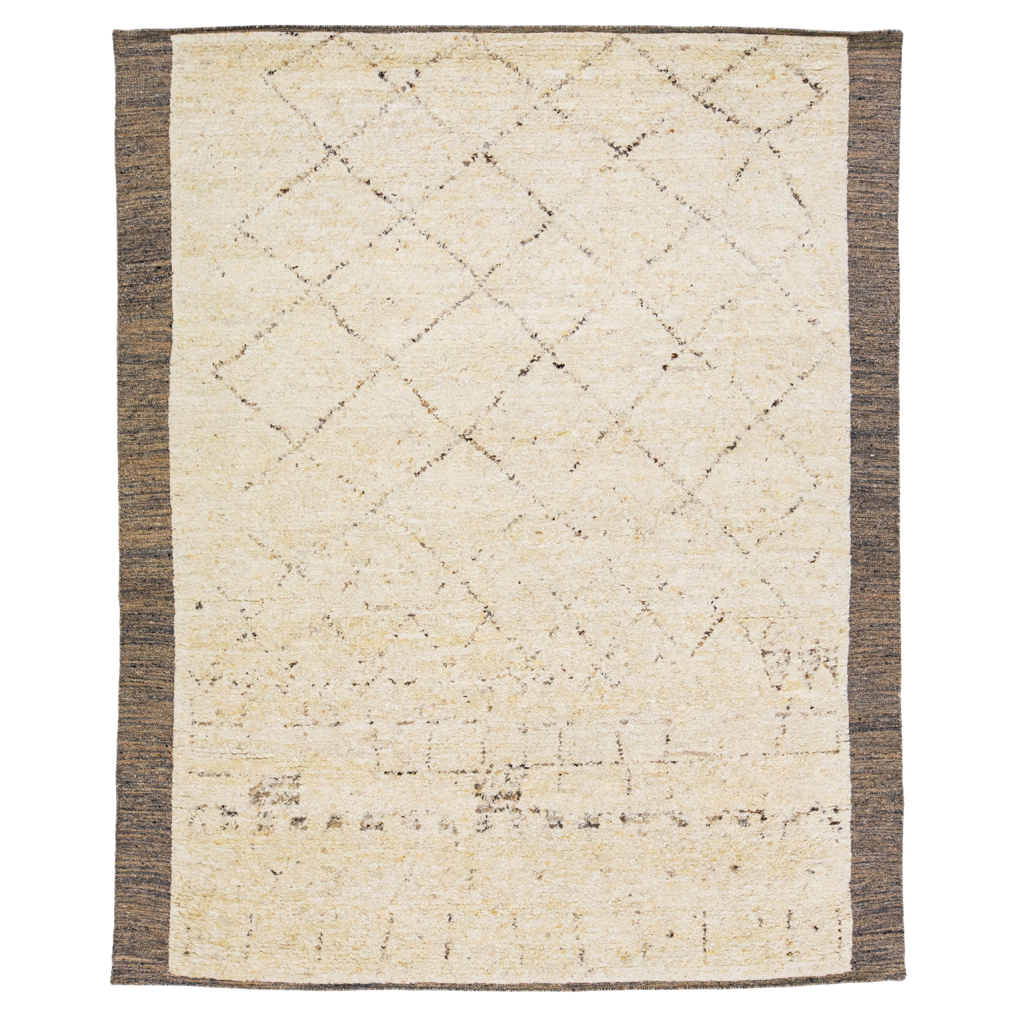 Handmade Moroccan Style Wool Rug With Tribal Motif In Beige For Sale