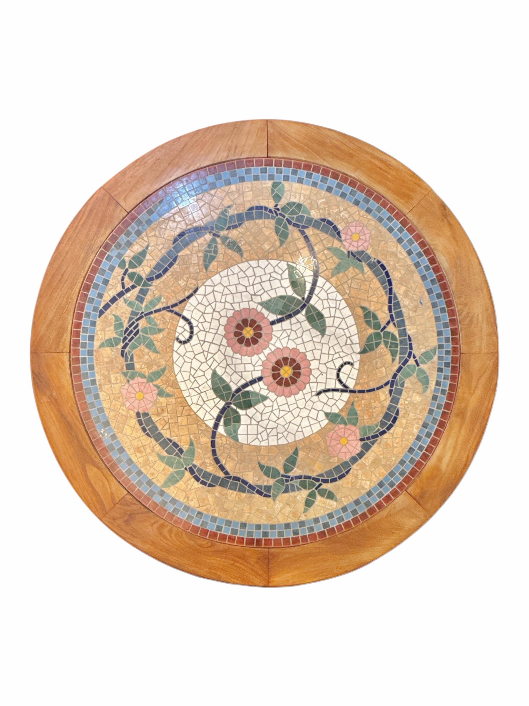 Add a touch of Parisian charm to your dining space or outdoor patio with this Handmade Mosaic French Tile Top Round Bistro Table. Featuring a stunning floral motif at its center, this table is an elegant fusion of traditional craftsmanship and