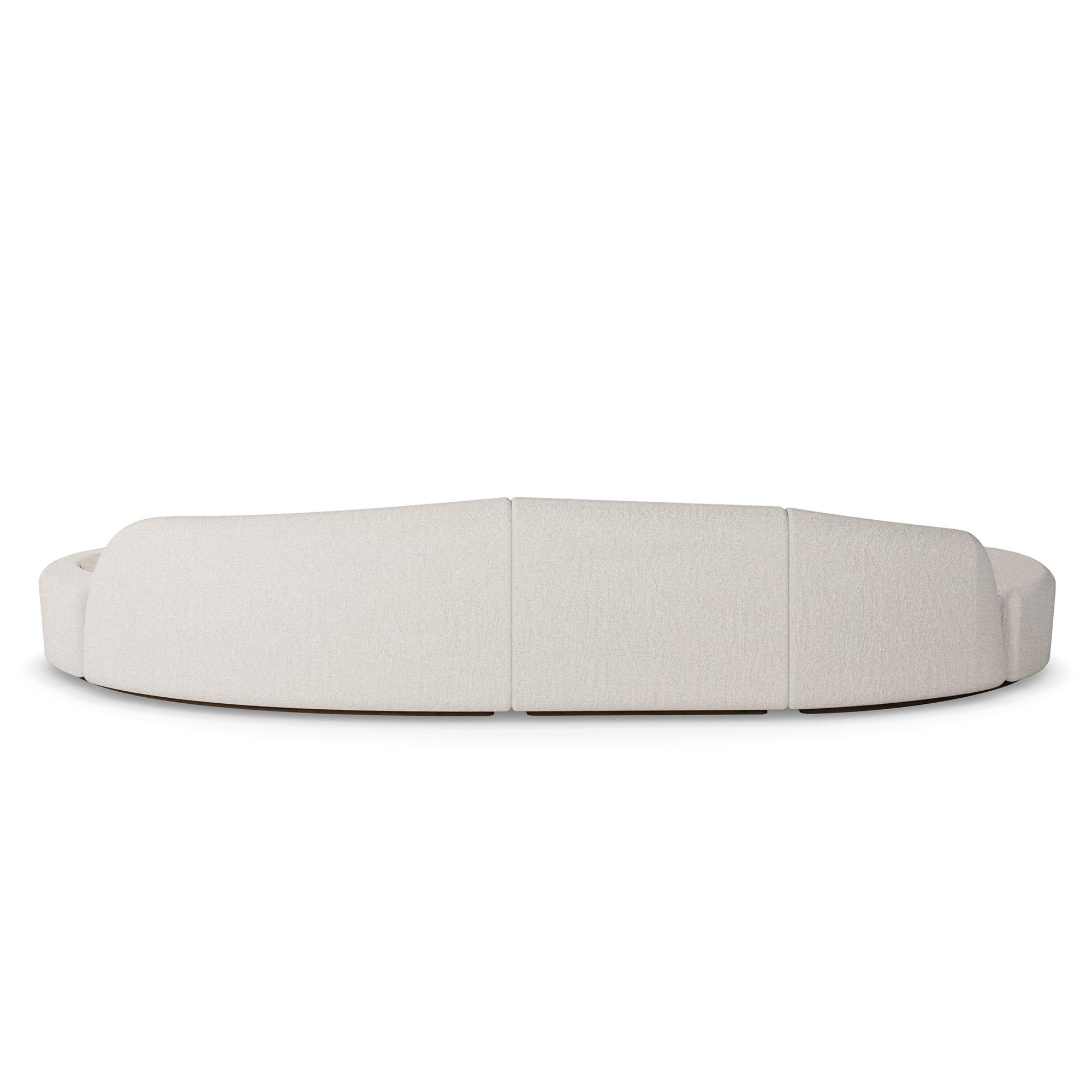 Nolita Harbour Nathalie II Sectional Sofa, an evolution of modern comfort and multifunctional design. This elegantly crafted sectional features plush, curved forms upholstered in luxurious boucle fabric, ensuring an exceptionally cozy seating
