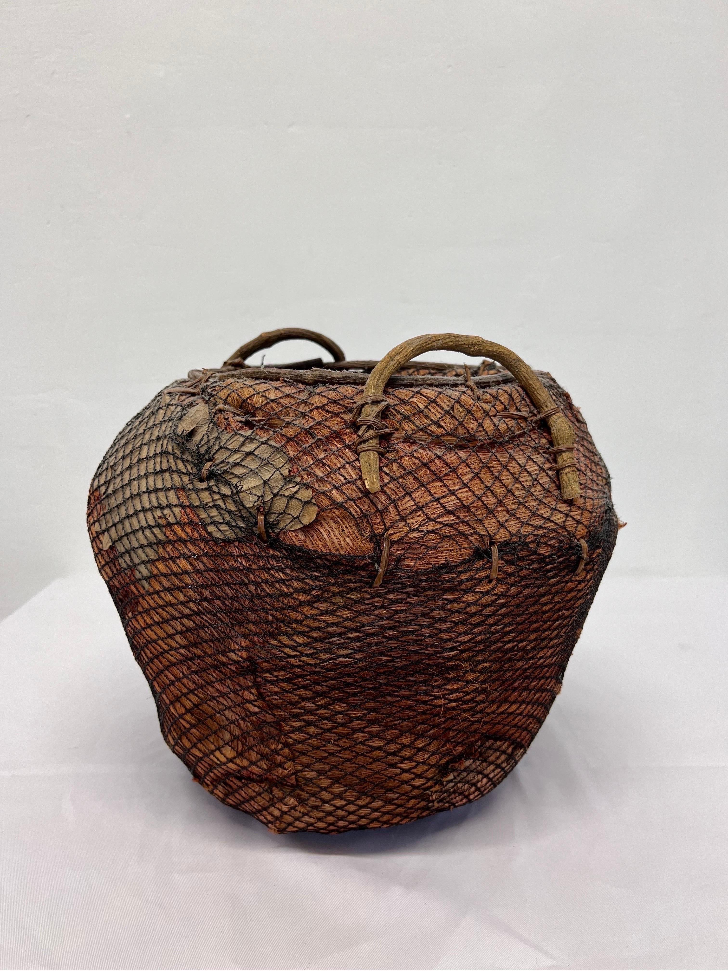 20th Century Handmade Natural Fiber and Leaf Basket Wrapped in Fish Net, 1970s For Sale