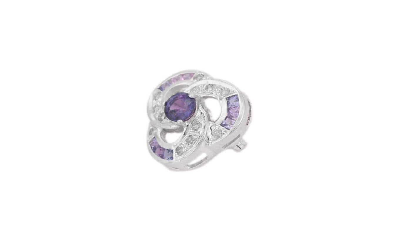 Natural Purple Sapphire Poppy Flower Brooch Pin in sterling silver which is a fusion of surrealism and pop-art, designed to make a bold statement. Crafted with love and attention to detail, this features 1.12 carats of purple sapphire which makes