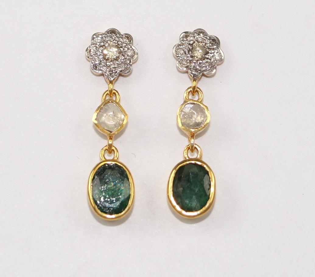 Stunning diamond silver emerald earrings consists of :

Metal- Silver
Metal Purity- sterling silver
Color of metal- Yellow gold plating 
Diamond- Natural uncut diamonds
Diamond origin- Natural earth mined
Diamond weight- 1.85cts
Gemstone- Natural