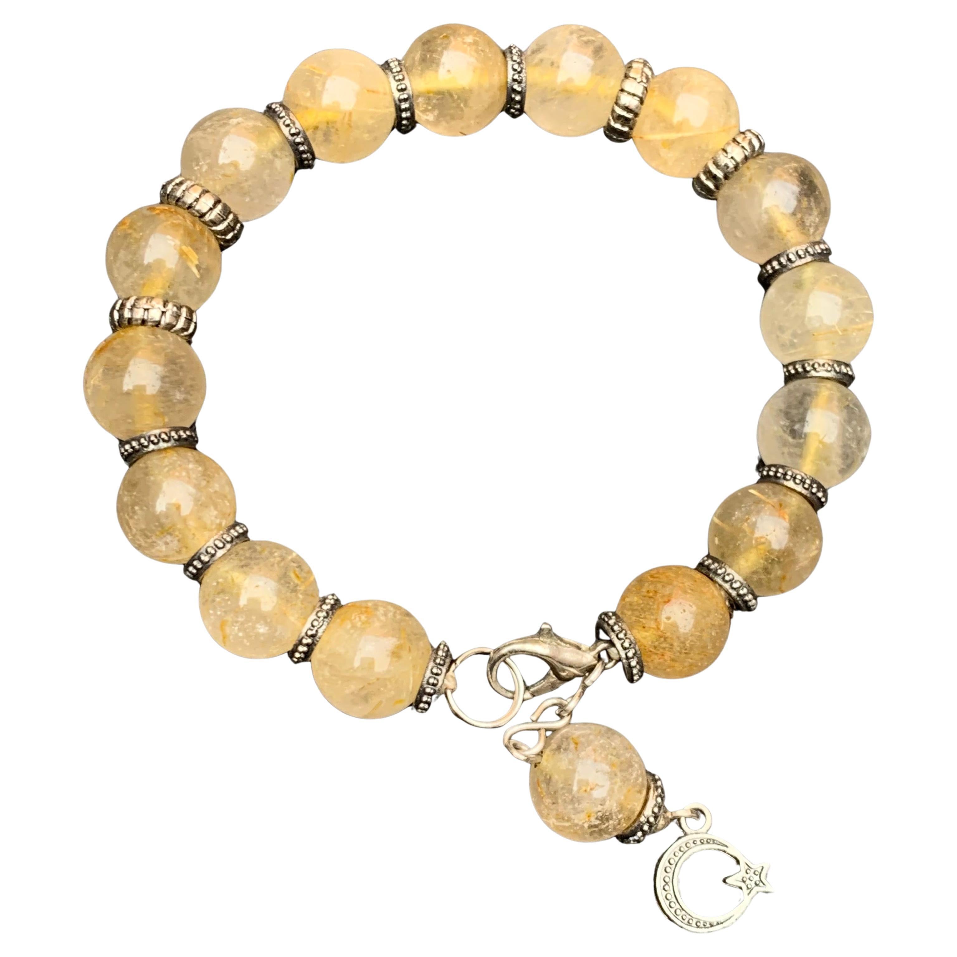 Bracciale fatto a mano in quarzo rutilico giallo naturale, perline da 10 mm, metallo argentato da 7 pollici in vendita