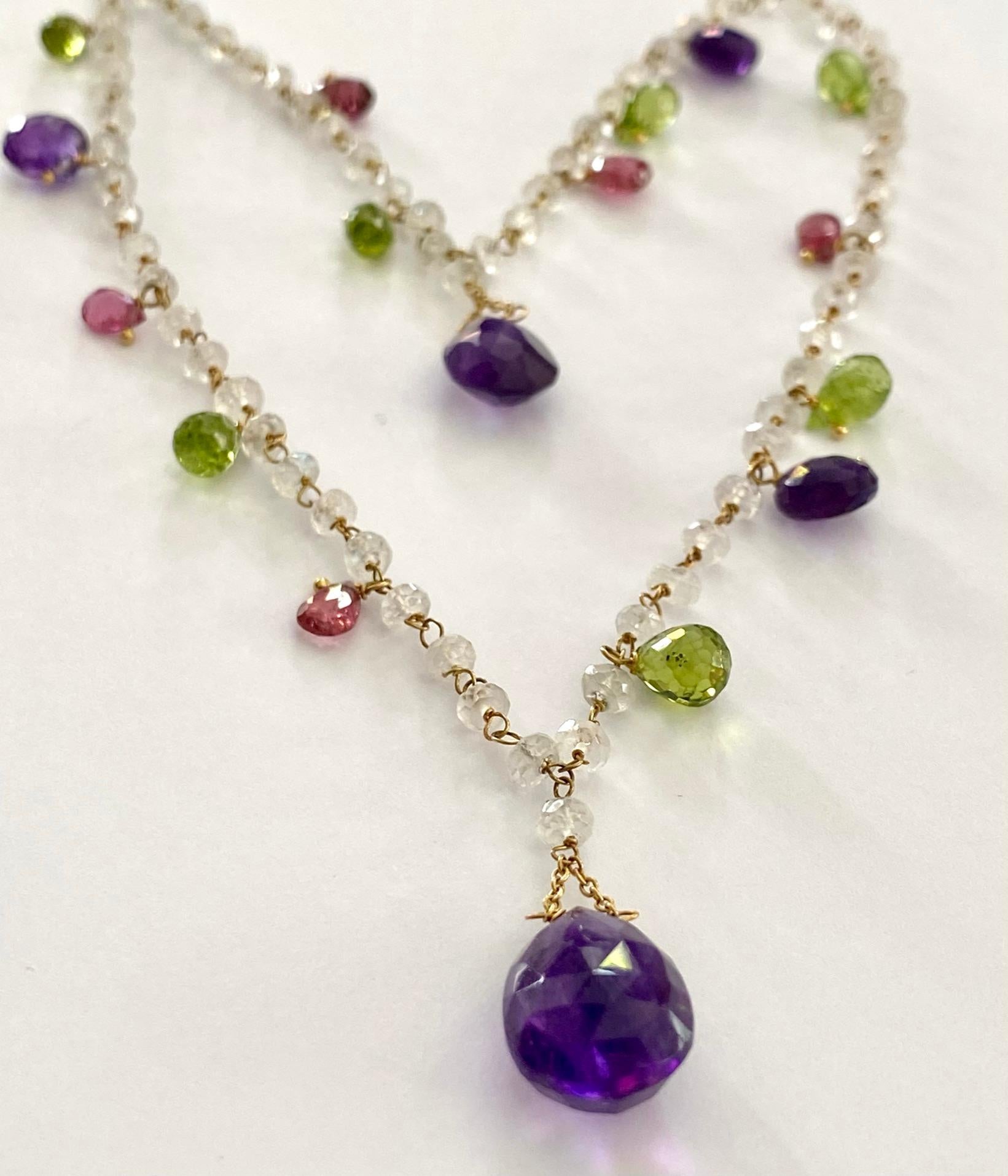 One (1) 18 Karat Yellow Gold Neclace, stamped: 750 
Set with:
5 pieces of natural Amethyst: Purple, Briolette.
7 pieces of Natural Peridot, Yellowich green, Briolette.
5 pieces of natural Rubellite, Pink, Briolette.
110 Pieces of Natural Moonstone,