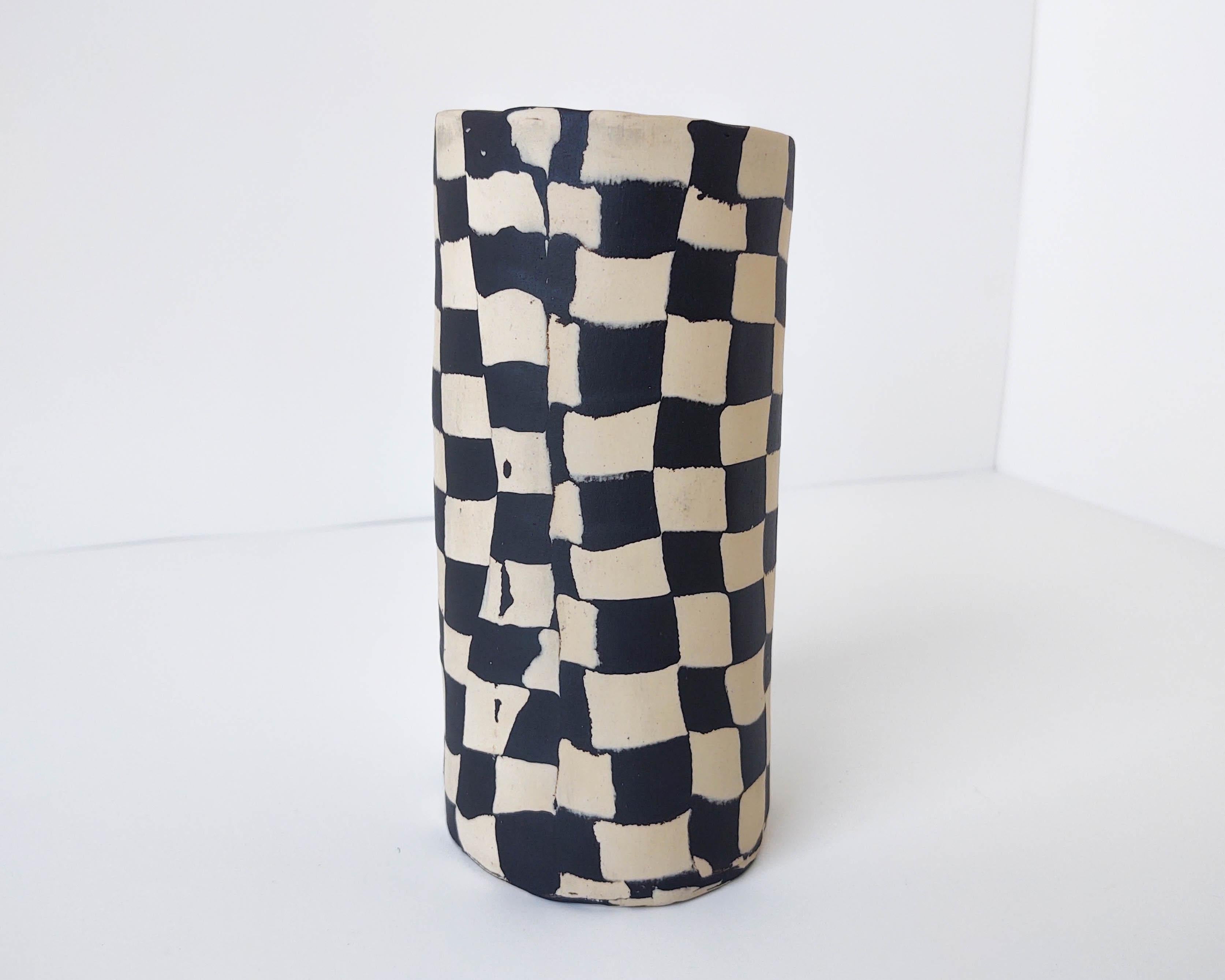 Handmade Nerikomi vase with two types of clay. Made and fired in Los Angeles by Fizzy Ceramics in 2021. Unglazed on the outside and black matte on the inside still revealing the checker pattern. Fired to cone 5 in oxidation, each piece is watertight