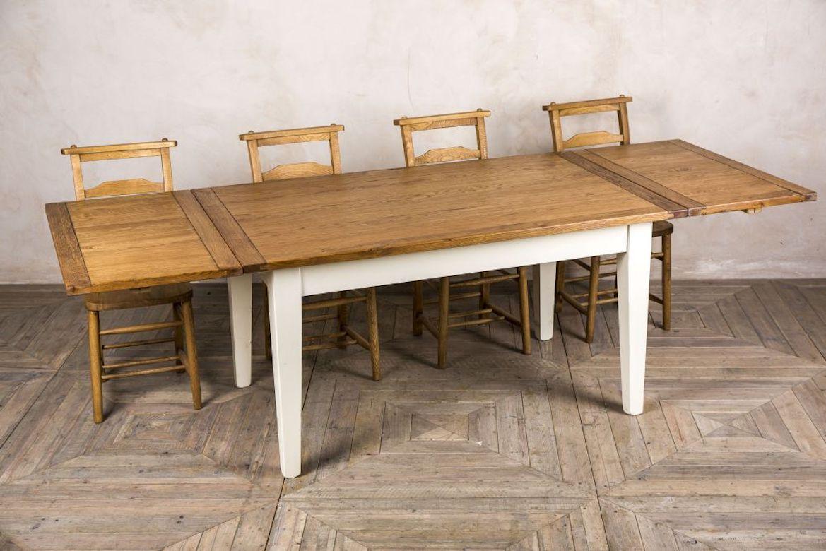 A fine handmade oak extending farmhouse table, 20th century.

A Classic piece of English furniture; this pine and oak extending farmhouse table is a new addition to our extensive range of kitchen and dining tables.

This oak and pine extending
