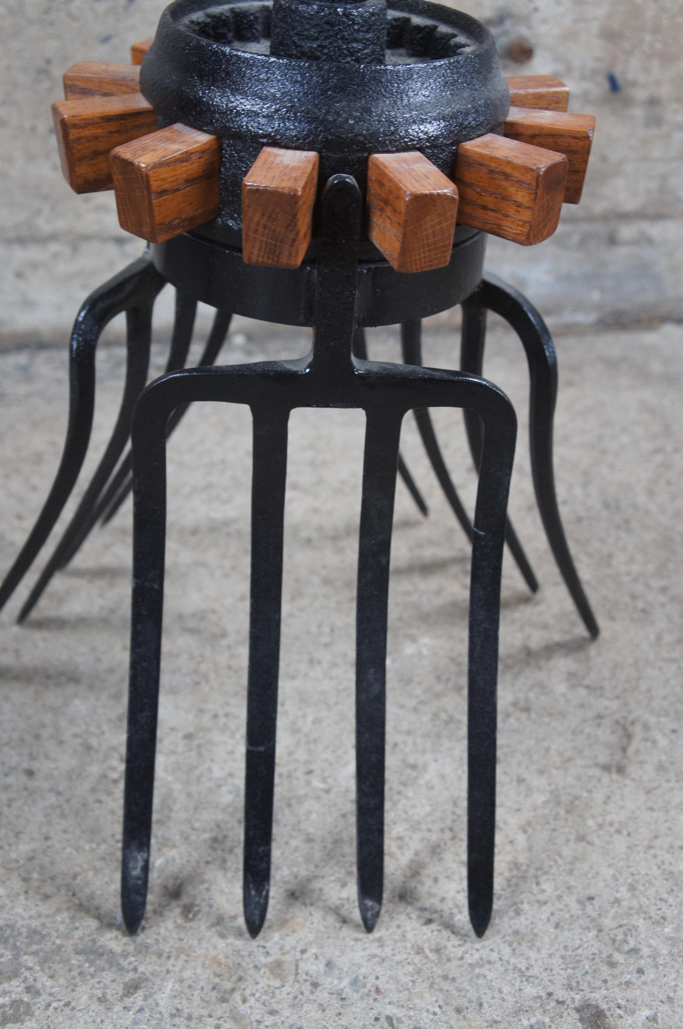 20th Century Handmade Oak Industrial Reclaimed Cast Iron Wagon Wheel Pitchfork Bistro Table For Sale