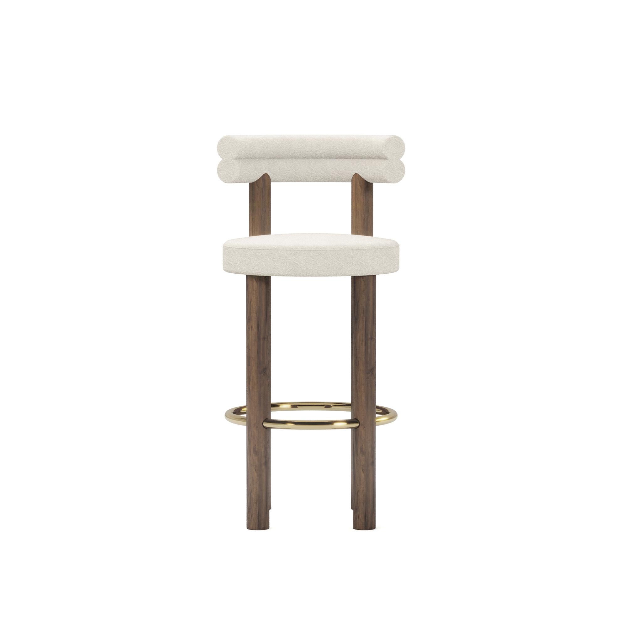 The Odette Bar Chair by Nolita Harbour is a perfect fusion of modern design and timeless elegance, crafted to elevate any bar or kitchen area with its sophisticated charm. This bar chair combines luxurious materials with a sleek silhouette, offering