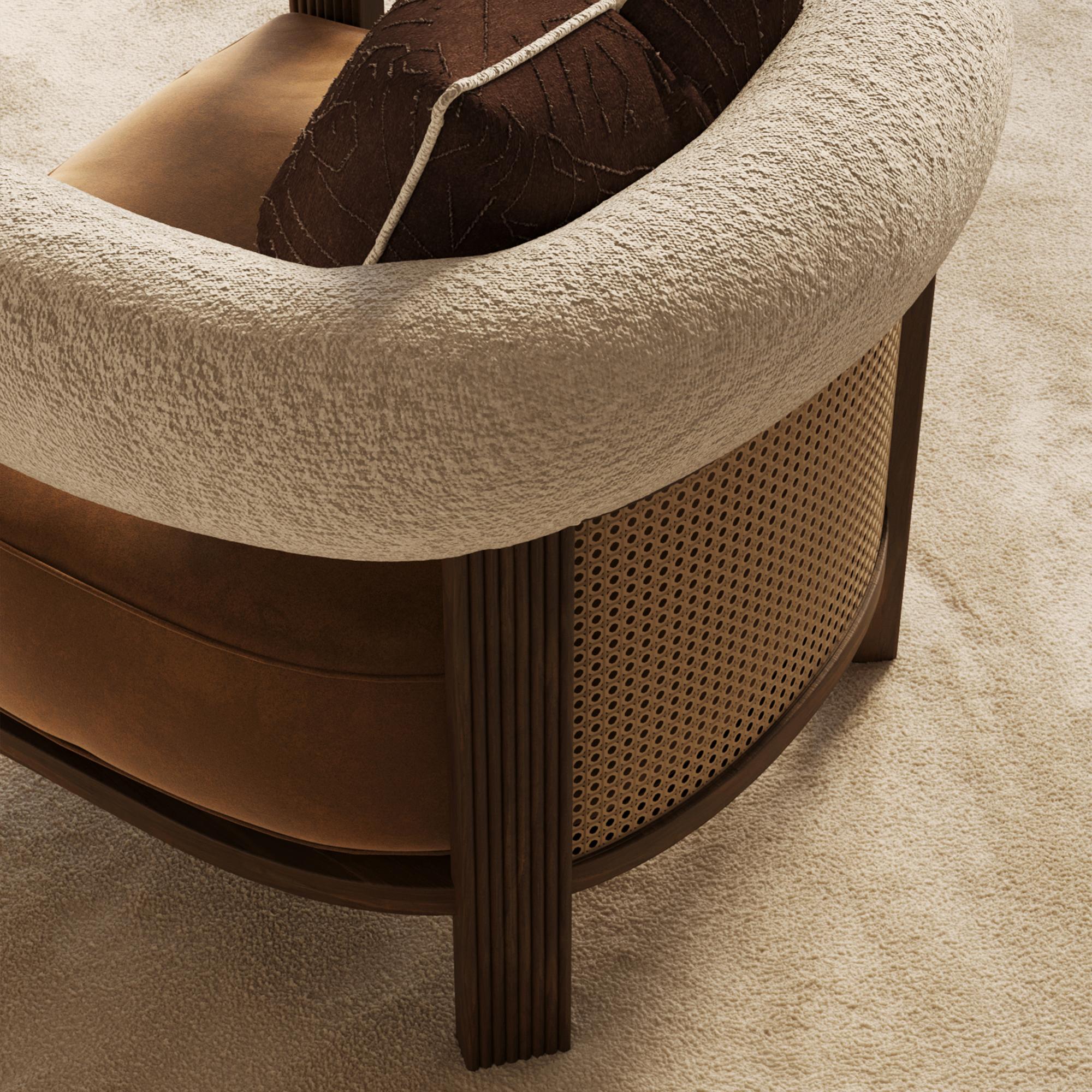 Nolita Harbour Olivia Armchair is a masterpiece of modern elegance and comfort. This beautifully designed armchair features a plush, spacious seat upholstered in luxurious fabric, ensuring a cozy seating experience. The standout feature of the