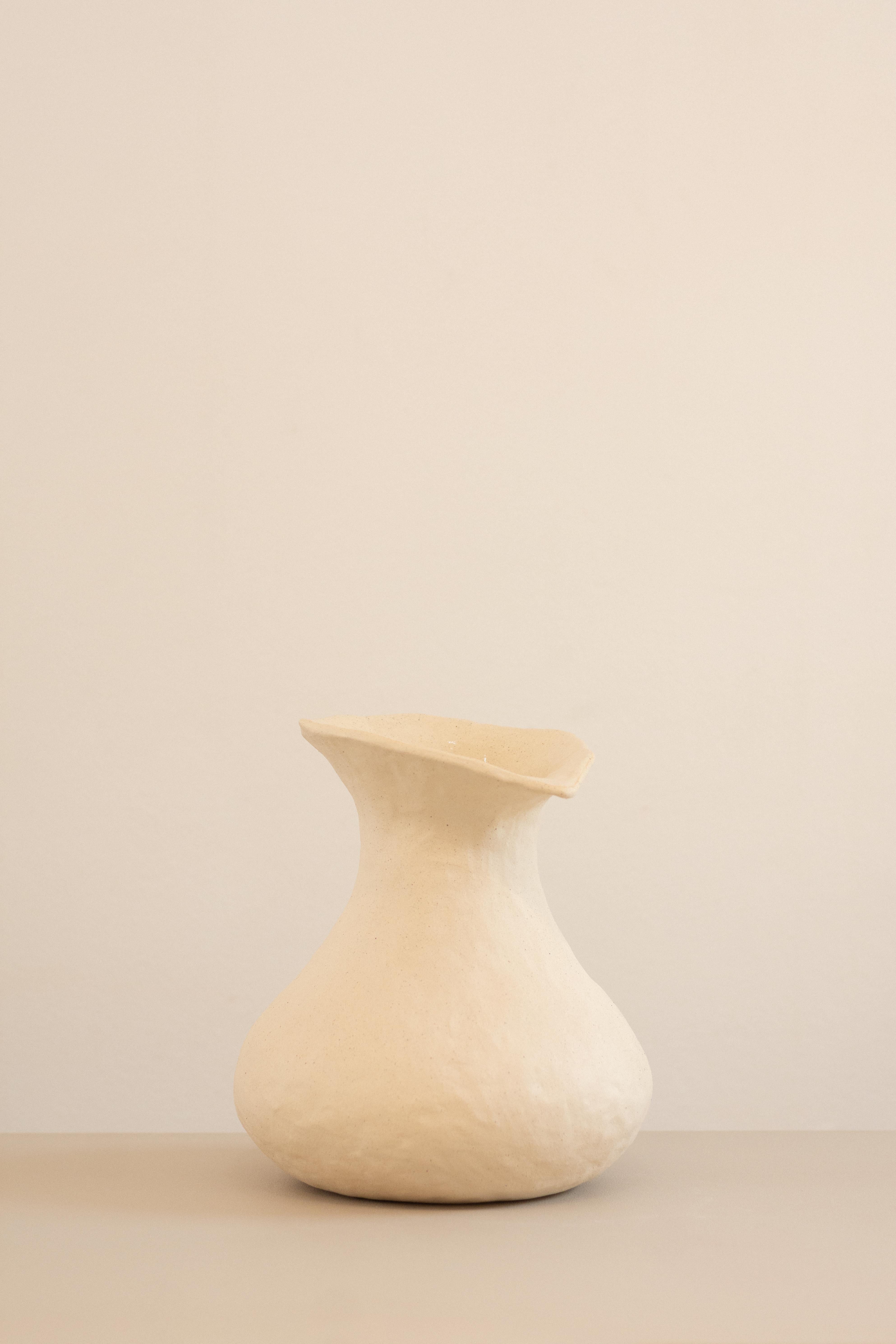This vase is part of the Rupa series, a collection of pieces developed without the use of molds. Each piece expresses the contours and textures imprinted by the hands of the artist, resulting in creations with intriguing and  complexity visual, that