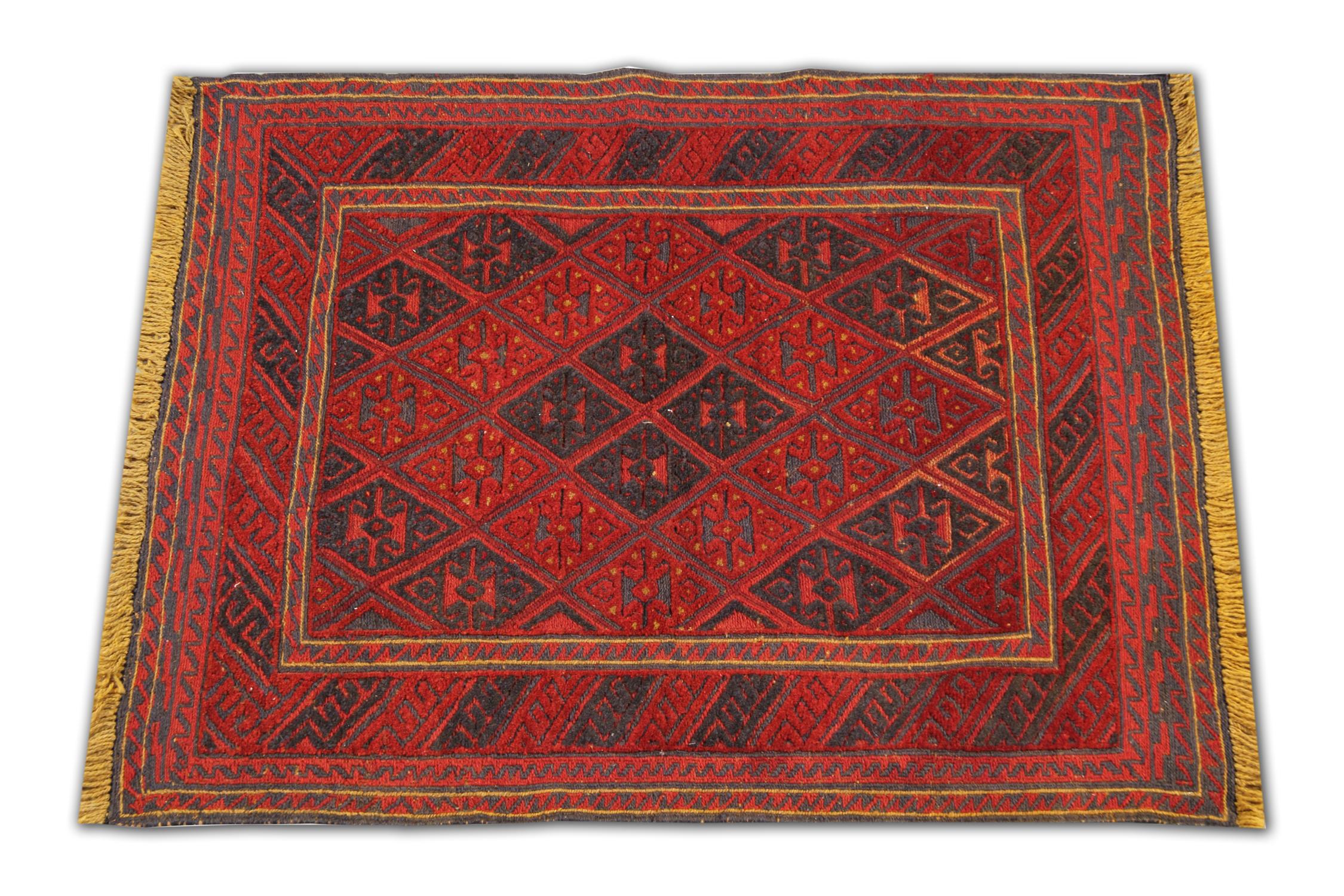 This handmade carpet is an excellent example of fine Afghan red rugs. Made by highly skilled Turkmen weavers in the north of Afghanistan. They have used hand-spun wool and 100% organic dyes for the production of these wool rugs. This tribal rug has