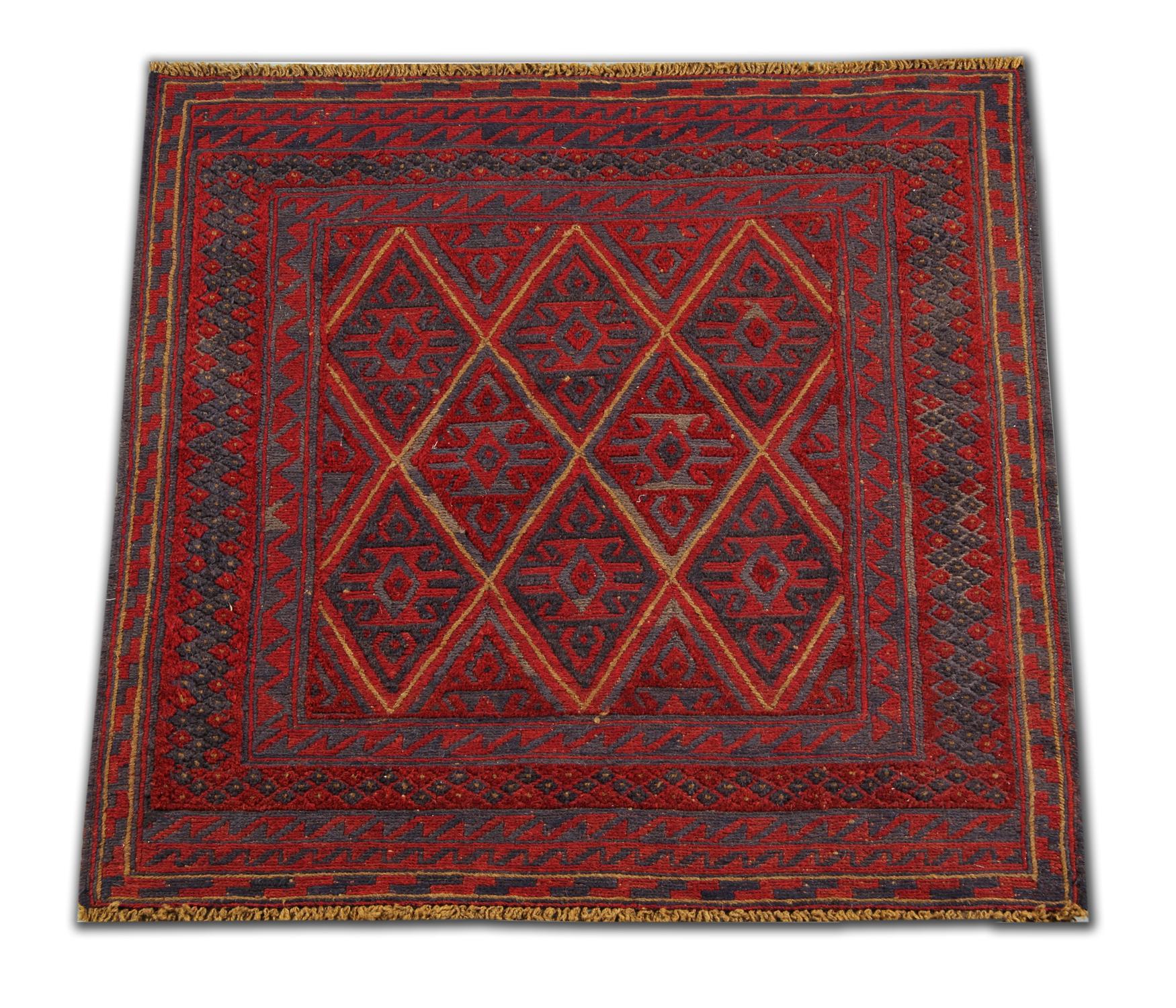 This handmade carpet is a fine example of Afghani rugs, made by highly skilled Turkmen oriental rug weavers in the north of Afghanistan. They have been constructed using hand-spun wool and 100% organic dying techniques that have been used for