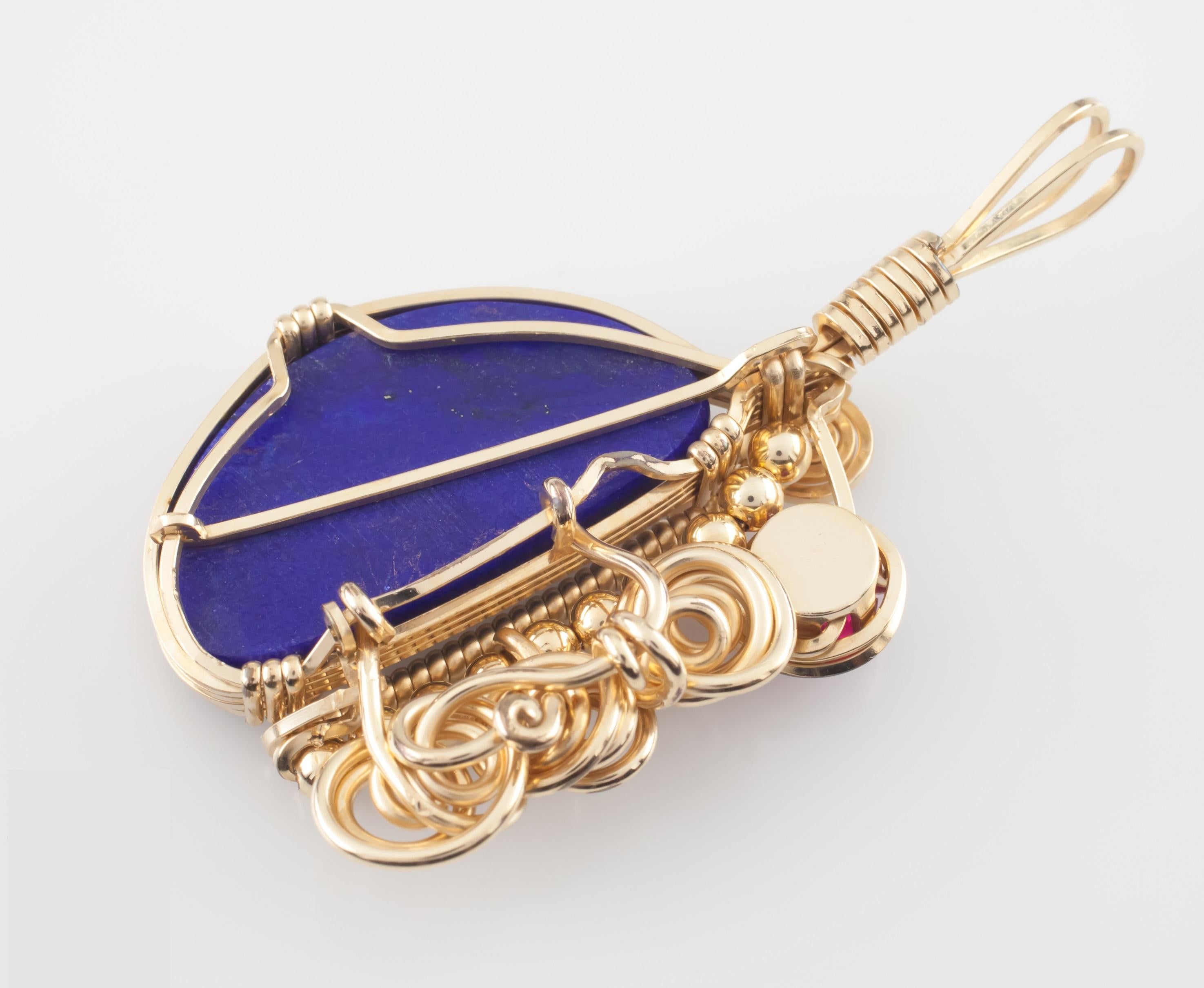 A Unique Handmade Goldfilled Lapis And Tourmaline Pendant
Features Bezel-Set Lapis Lazuli and Prong-Set Round Cut Pink Tourmaline with Accents of Coils of Gold-Filled Wire
27 mm Wide
50 mm Long (Including Bail)
Dimensions of Lapis = 27 mm x 15