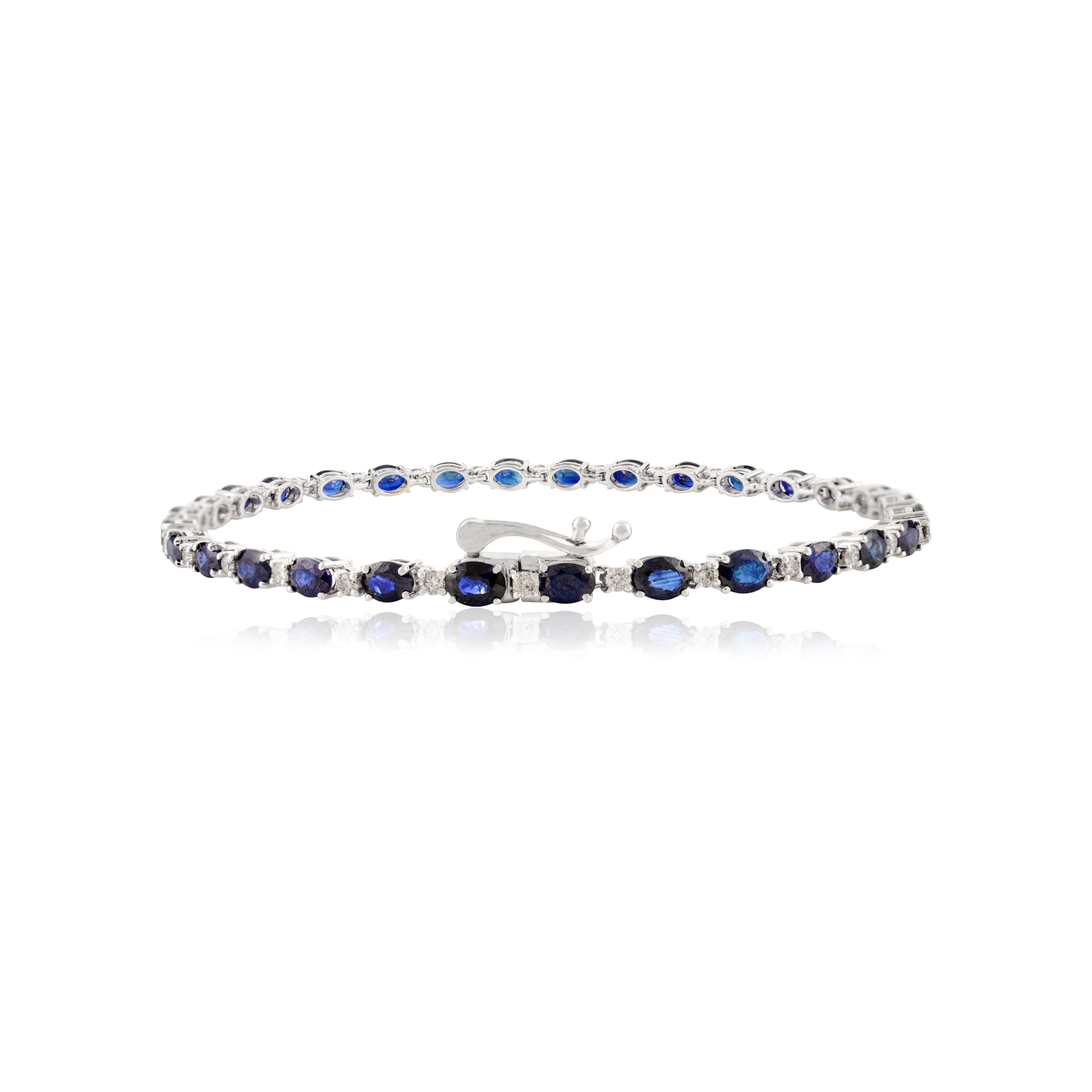 This Handmade Oval Cut Blue Sapphire Diamond Tennis Bracelet 14k White Gold showcases 6.08 carat endlessly sparkling natural blue sapphire and 0.66 carats of diamonds. It measures 7 inches long in length. 
Sapphire stimulates concentration and