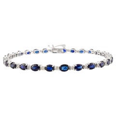 Bracelet tennis en or blanc 14 carats fait à la main, avec saphir bleu taille ovale et diamants