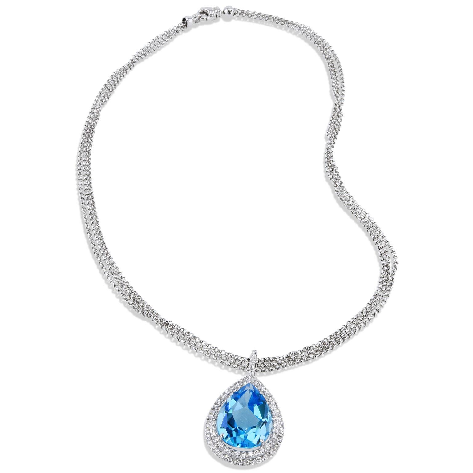 Handmade Pear Shaped Blue Topaz Diamond Drop Pendant.

This beautiful pendant features a 17.74 carat pear shaped blue topaz.
There is an additional 122 pieces of F/G color diamonds that surround this stunning stone that total .95 carats.

This