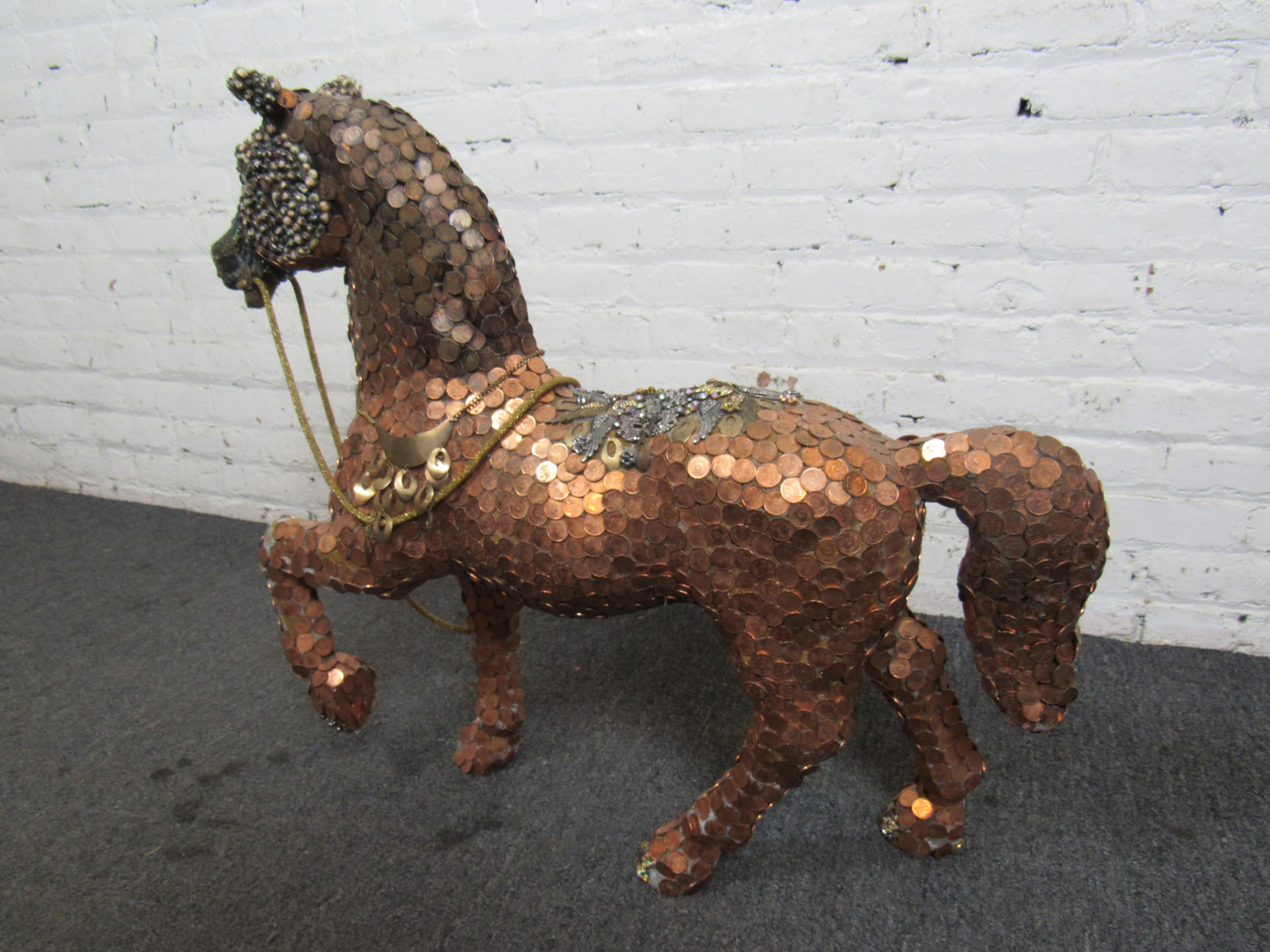 This unusual horse sculpture is adorned with ornate pieces of metal and copper coins. 
Please confirm item location with seller (NY/NJ).
