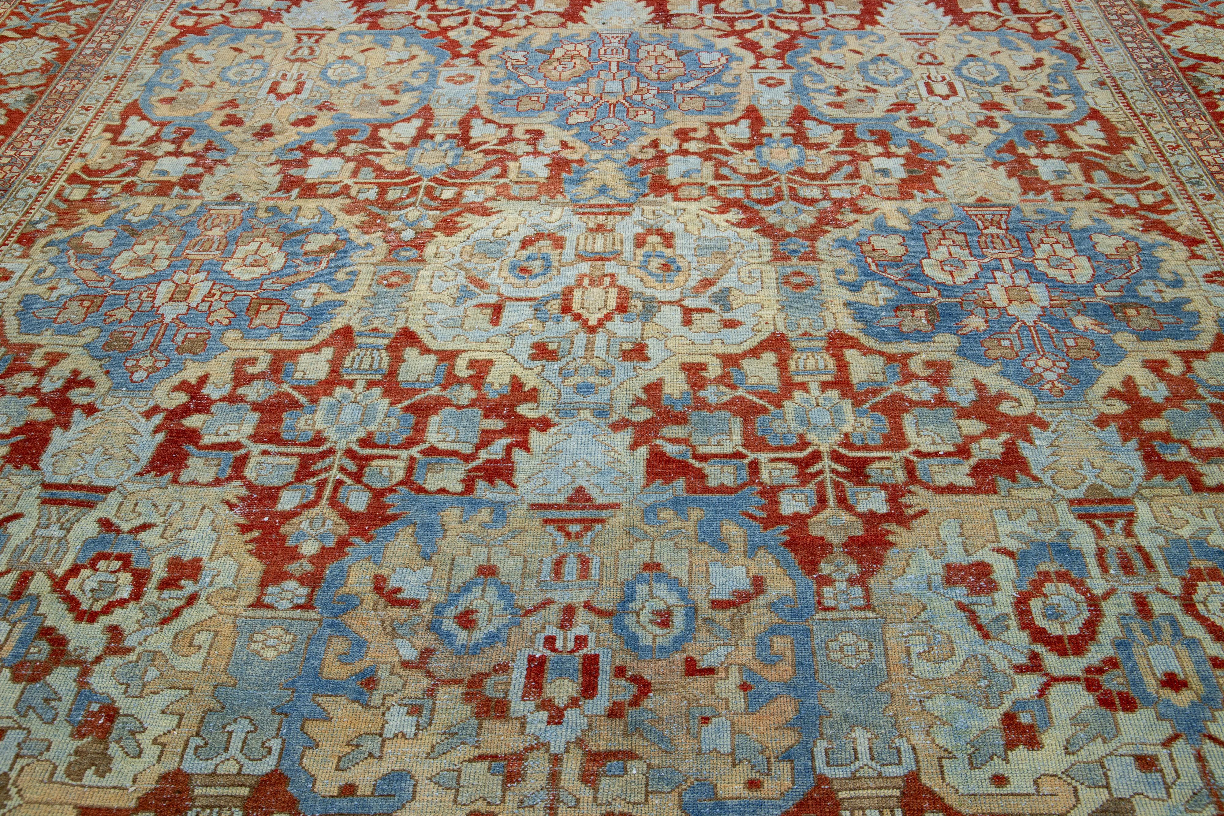 20th Century Handmade Persian Bakhtiari Red Wool Rug featuring an Allover Floral Pattern For Sale