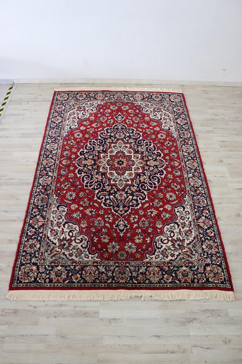 Beautiful 20th century ( 1980s circa)  persian kashan large rug handmade in wool. This fantastic rug it is in the main color red with a motif of central medallions. Elaborate and rich decoration. Used conditions.
   
