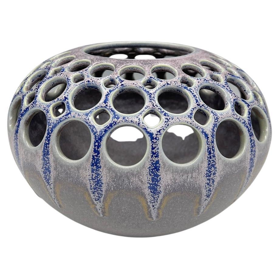 Handmade Pierced Ceramic Orb with Variegated Crystaline Glaze For Sale