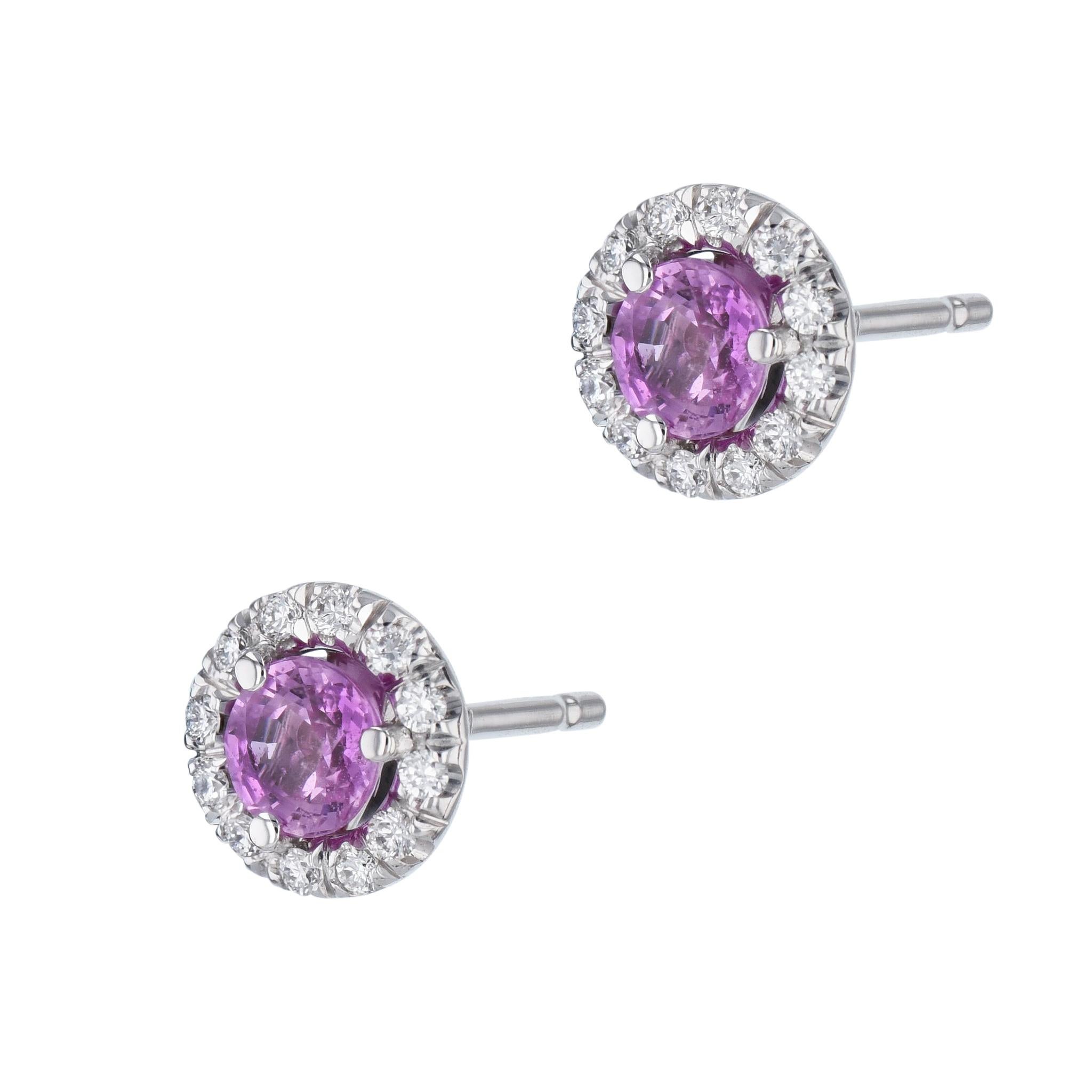 These beautiful pink sapphire pave diamond halo stud Earrings are handcrafted with 18 karat white gold for an exquisite finish. The centerpiece pink sapphire, is encircled with a halo of 24 sparkling diamonds. Make this H&H piece yours for a truly