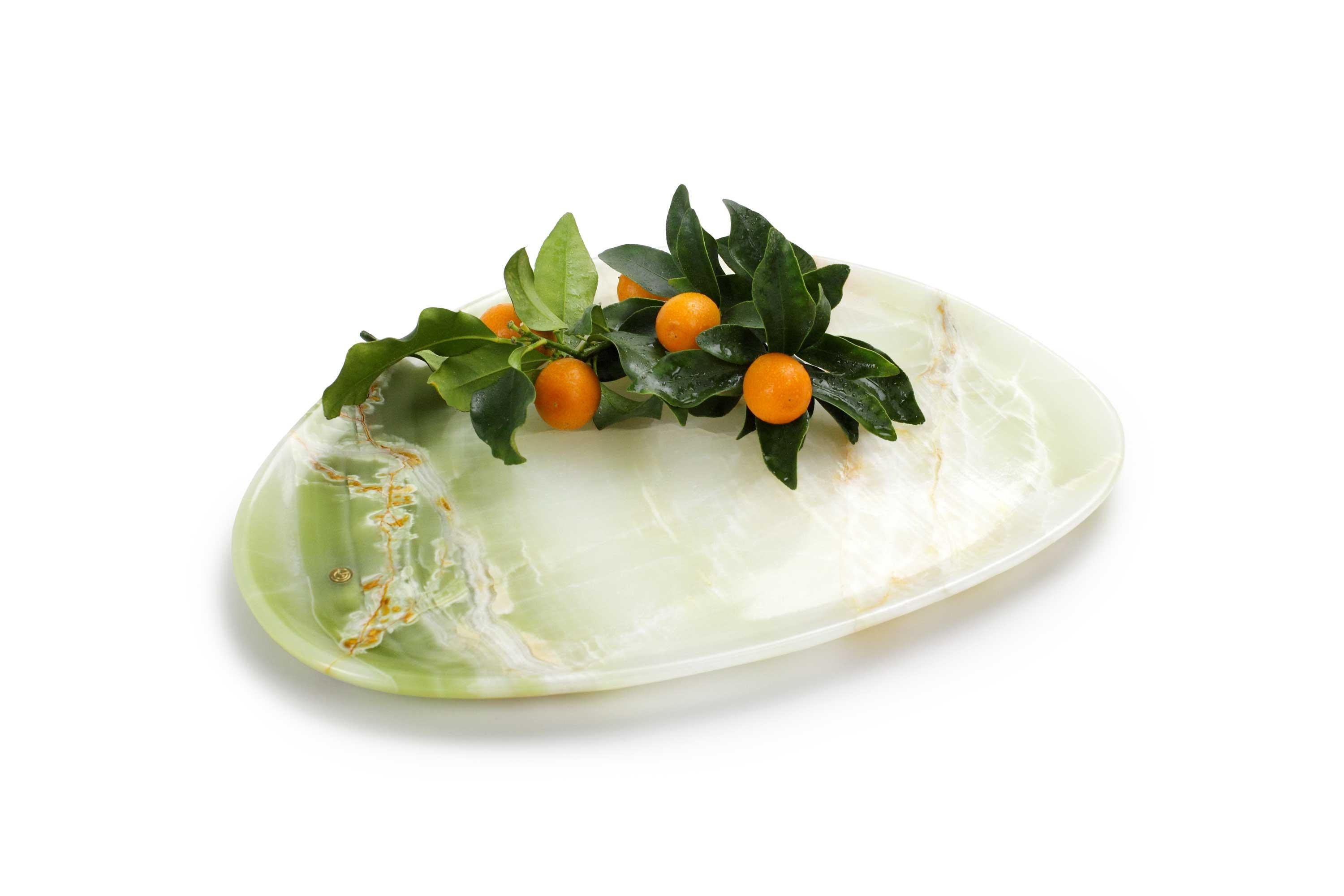 Hand carved presentation plate from green onyx. Multiple use as plates, platters and placers. The polished finishing underlines the transparency of the onyx making this a very precious object. 

Dimensions: Medium L 30, W 28, H 1.8 cm, also