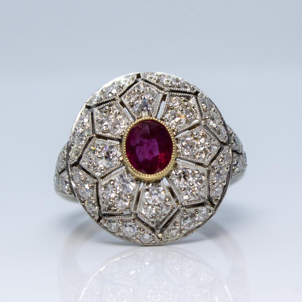 Description

Composition: Platinum

Stones:
·1 natural Burma ruby that weighs 1.10ctw.
·42 Old mine cut diamonds of H-VS2 quality that weigh 1.30ctw.

Ring size: 6 ¾     (Resizing available)
Ring face:  19mm by 19mm
Rise above finger: 8mm.­
Total