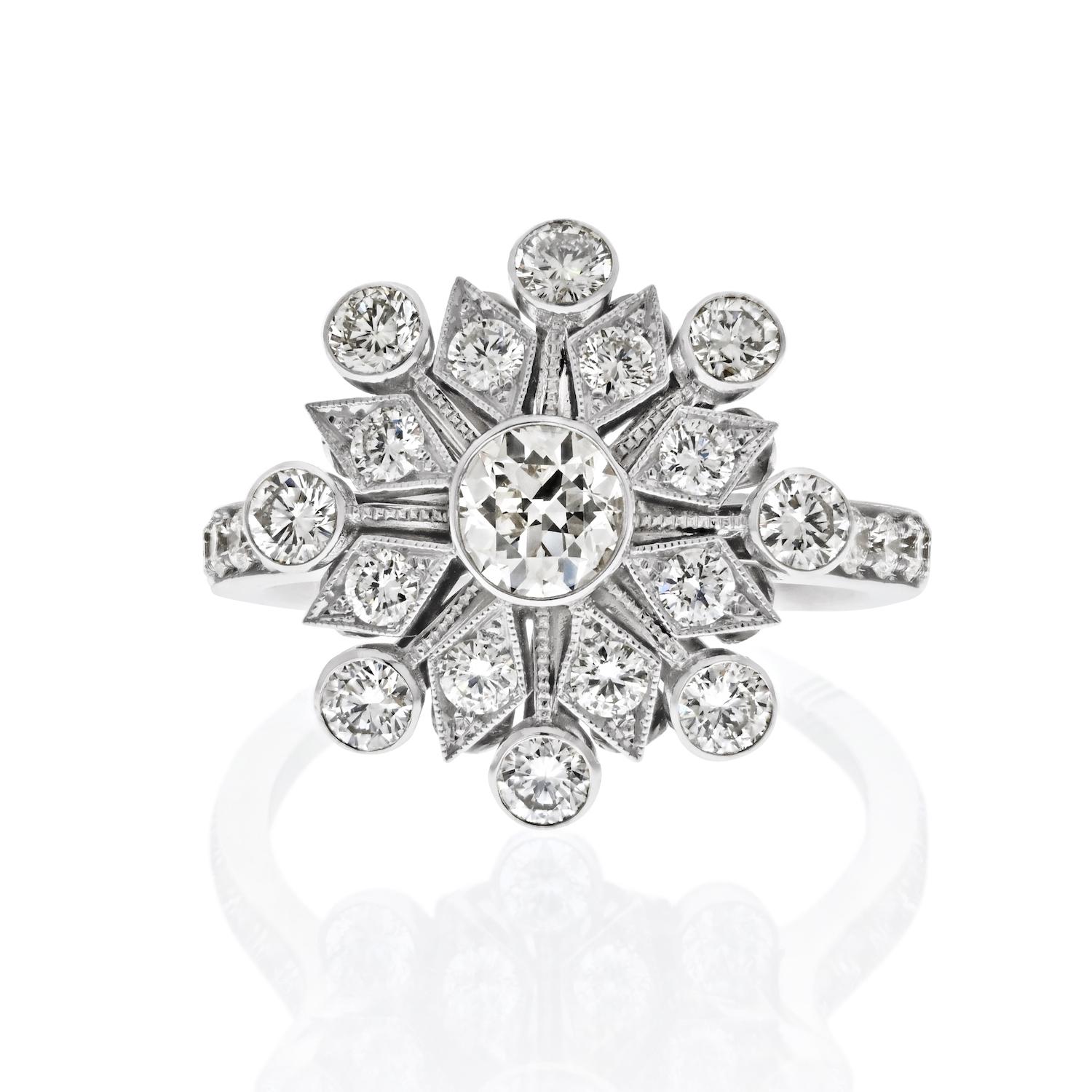 Elegance and Artistry: The Handmade Platinum Snowflake Diamond Ring.

Celebrate the art of fine jewelry with this exquisite handmade platinum diamond ring, a masterpiece of design and craftsmanship. Resembling the intricate beauty of a snowflake,