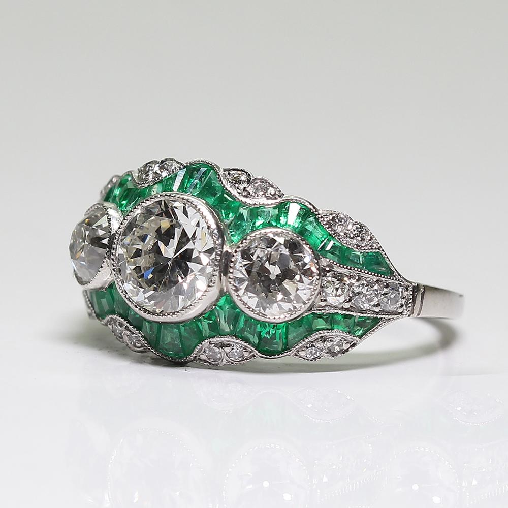 Handmade Platinum Contemporary 2.25 Carat Diamond and 2 Carat Emerald Ring In Excellent Condition In Miami, FL