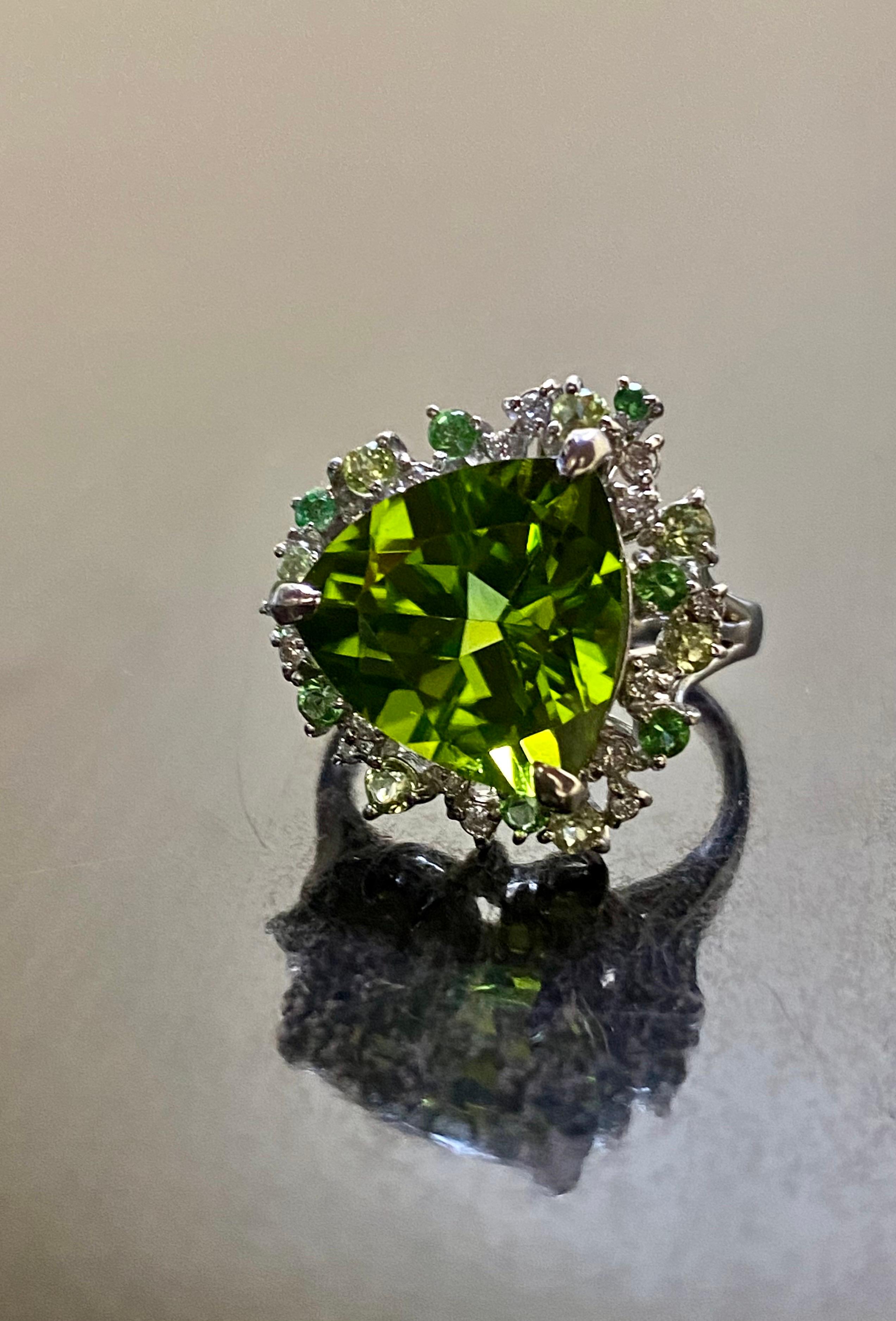 DeKara Designs Collection

Our latest design! An elegant and lustrous and unique amazing trillion cut peridot surrounded beautifully by diamonds and round peridots in a halo setting.

Metal- 90% Platinum, 10% Iridium.

Stones- Genuine Trillion