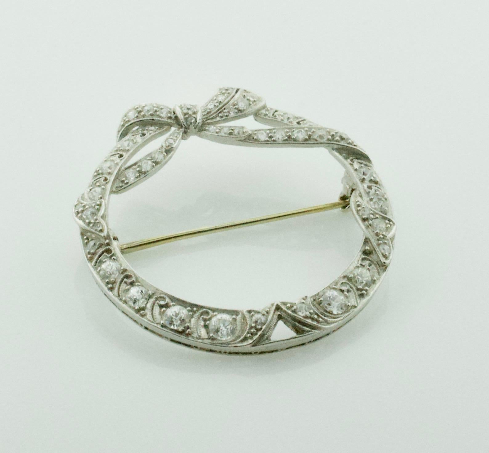 Circa 1920's Handmade Platinum Diamond Circle Brooch
Forty Old European and Single Cut Diamonds weighing 2.00 carats approximately [GH VVS-SI]
Beautifully Constructed  
