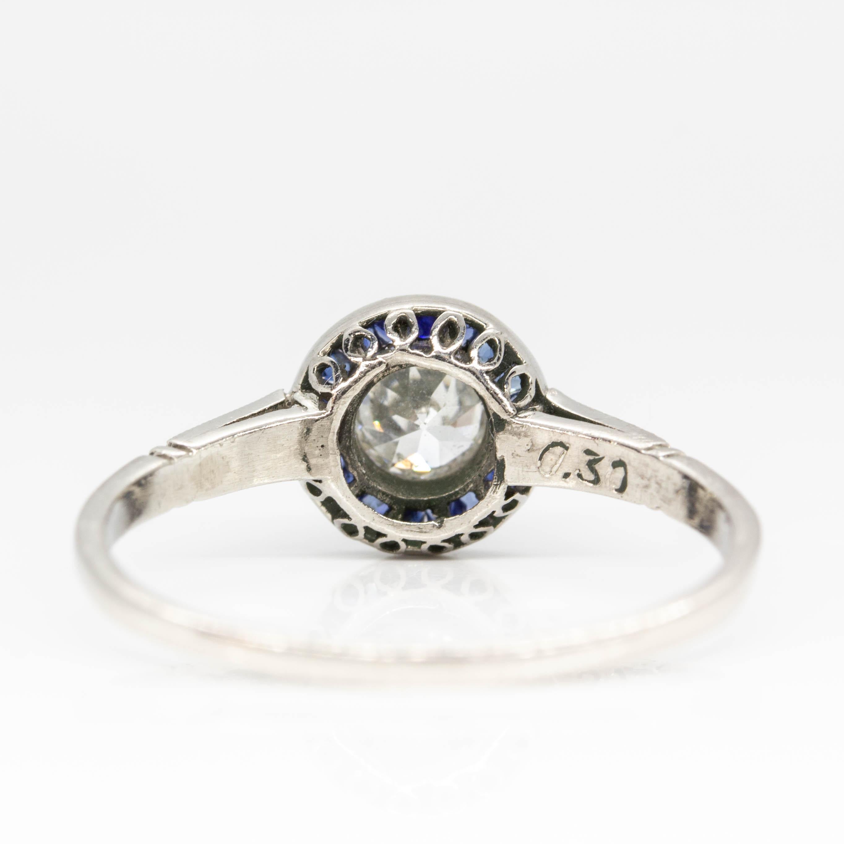 Art Deco Handmade Platinum Diamonds and Sapphire Halo Ring For Sale
