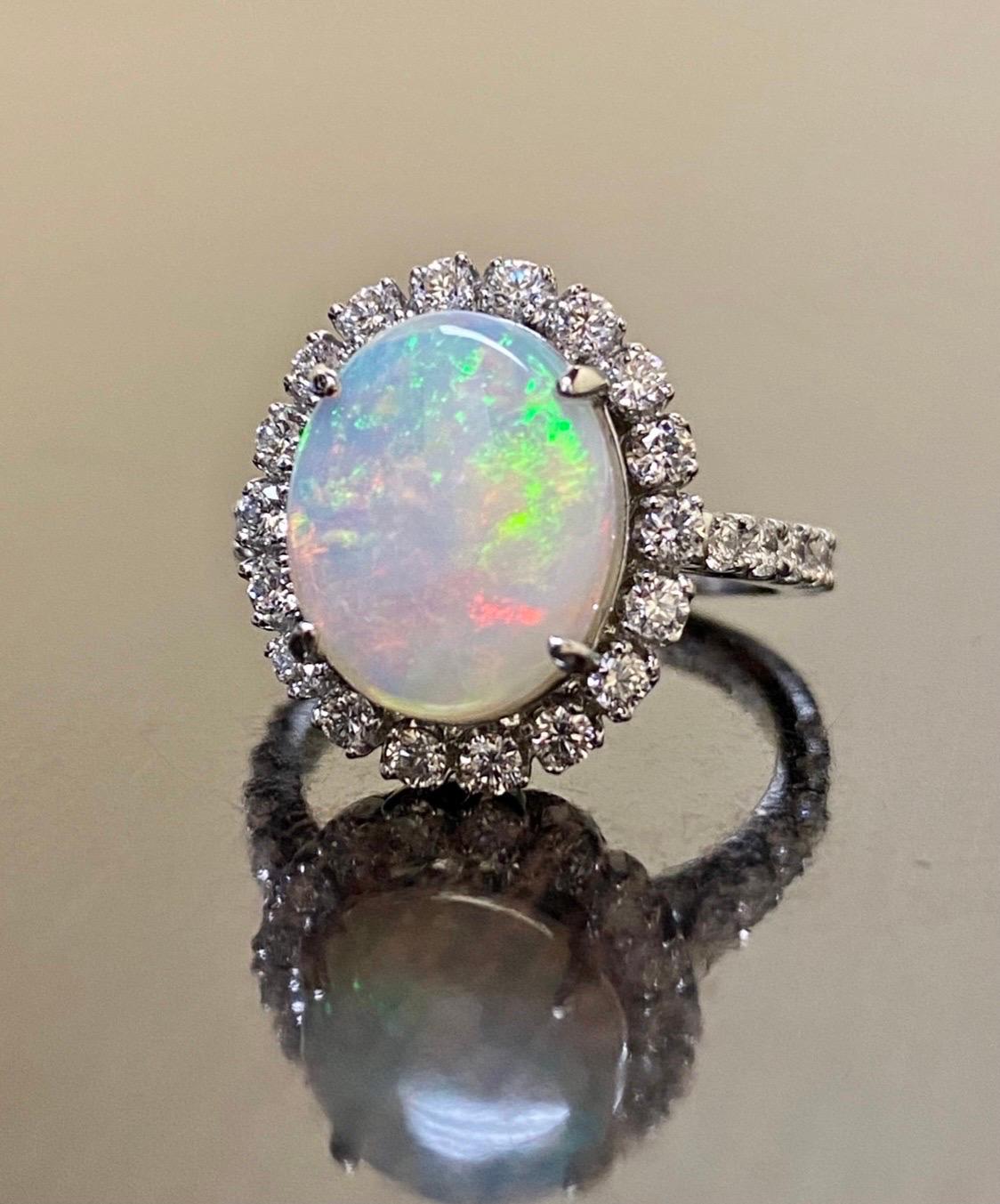 DeKara Designs Collection

Our latest design! An elegant and lustrous Australian Opal surrounded beautifully by diamonds in a halo setting.

Metal- 90% Platinum, 10% Iridium.

Stones- Genuine Oval Australian Opal 12.30 x 10.0 MM, 30 Round Diamonds
