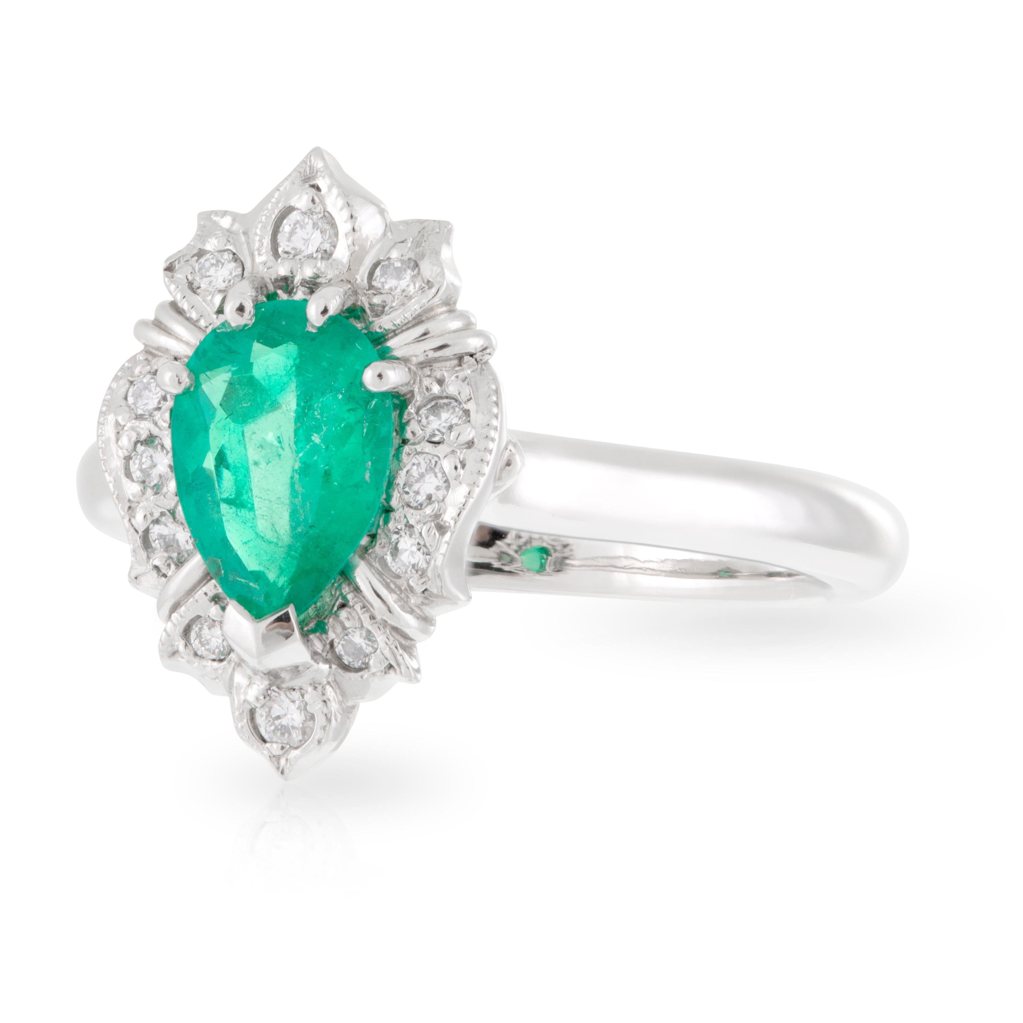 Platinum Pear 0.78ct Columbian type Emerald with Diamond Art Deco Style Halo Dress Ring. TDW 0.135ct
