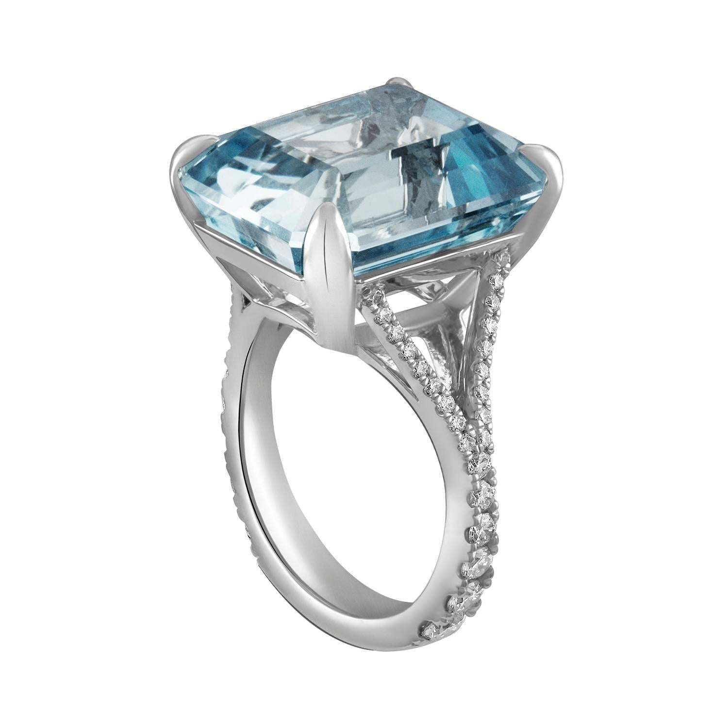 This 18.15ct emerald cut natural Brazilian aquamarine is set in Shah & Shah's handmade platinum and diamond split shank cocktail ring with 48 colorless diamonds that total 0.80cts. 

The ring is a size 7. Initial sizing is complimentary and an