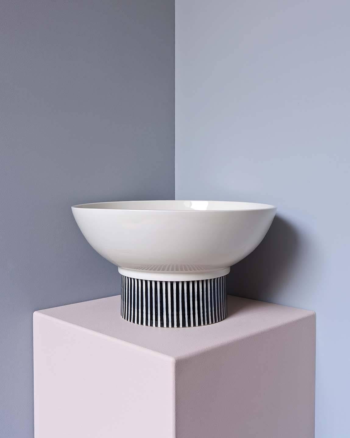 This hand-thrown porcelain Bowl is a contemporary and functional stand out piece. Glossy white porcelain with hand carved stripes on the base. The bowl has a size of diameter 29cm, height 16 cm. 

The first Atlas Crafts collection is thrown by