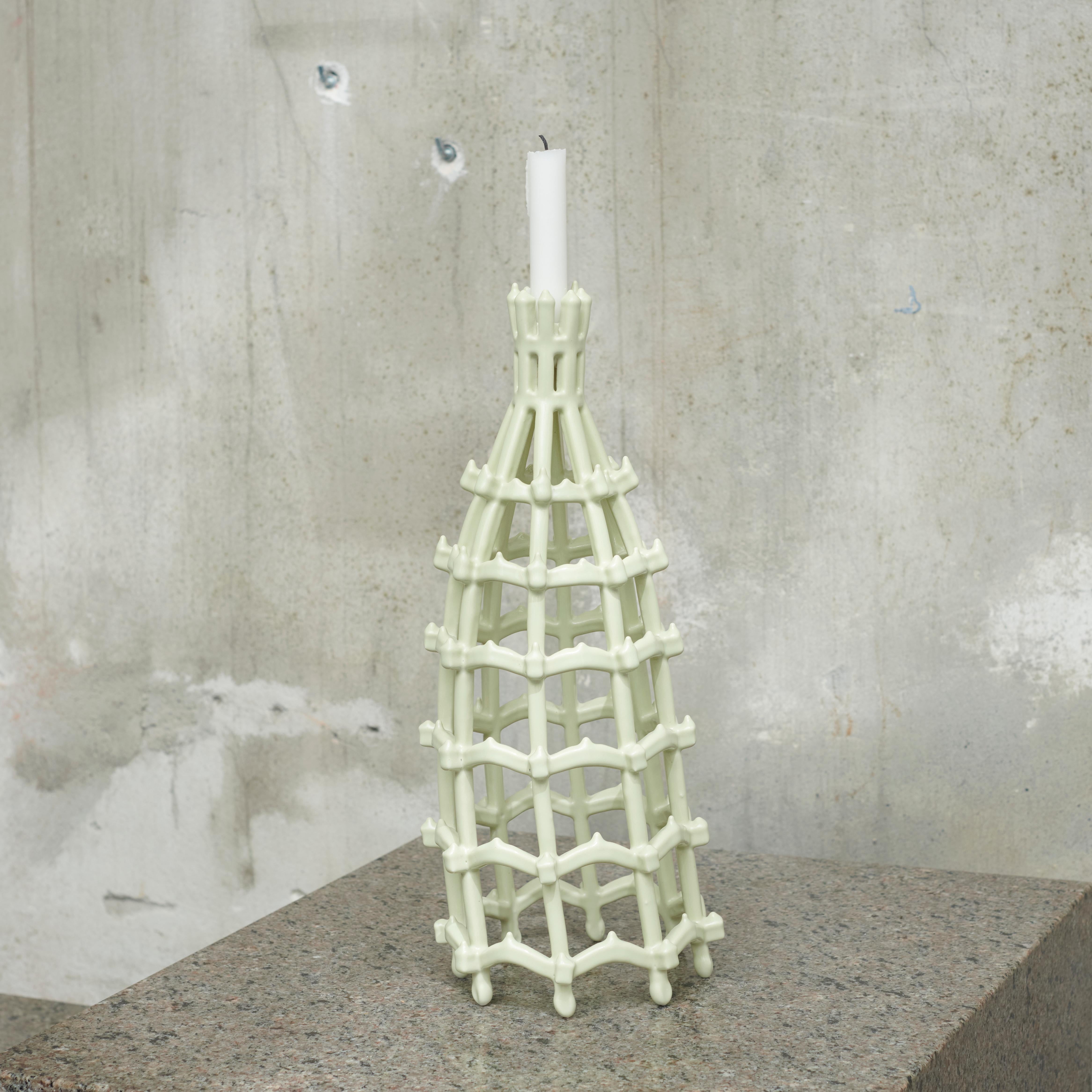 A handmade and one of a kind candleholder made in porcelain by artist duo Atelier Fig. 
Made by using a unique method developed by the artist duo using glazed hand-cut and sewn sponges. The material is dipped in the glaze and hereafter burned in the