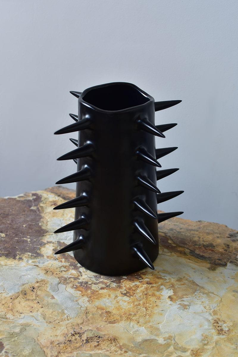 Beautiful black flower vase with spikes, perfect for showcasing your cherished blooms. Providing a unique perspective from every angle, this handmade ceramic vase blurs the line between functionality and ornament. Use it either as a fully functional
