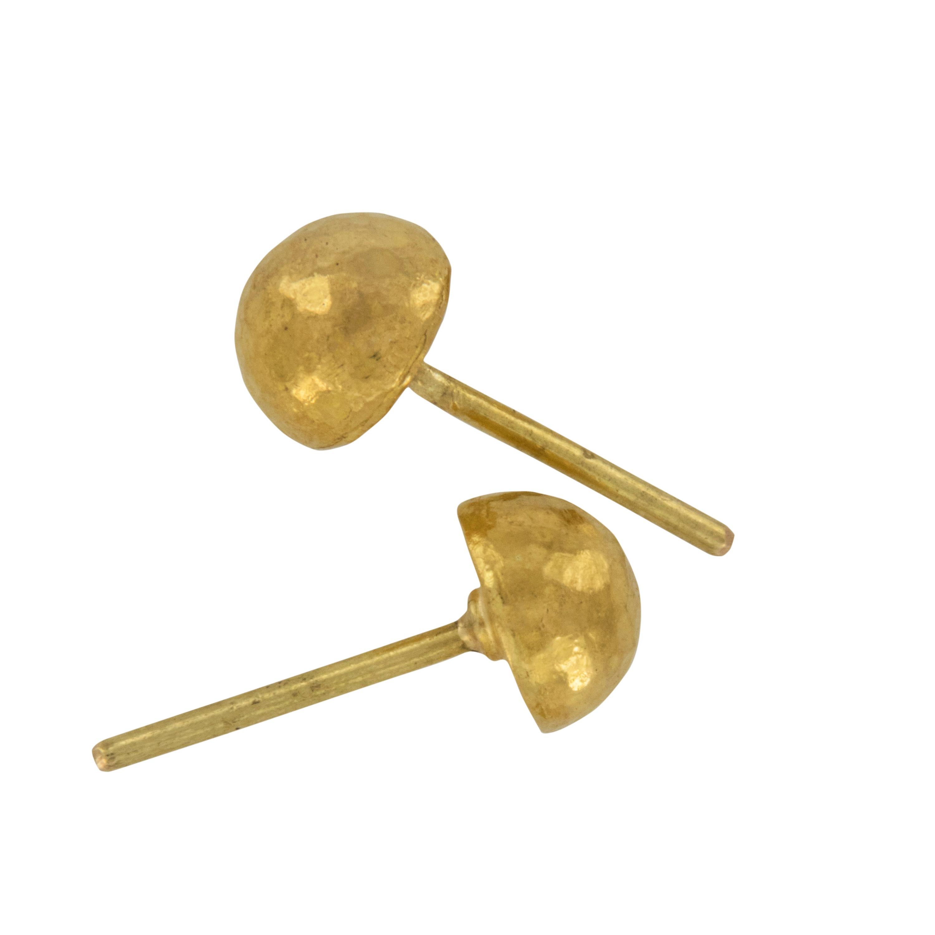 Rarest of all the golds, 24 karat gold is valued by all discerning investors. With it's unmistakable warm yellow color & hammered finish, these round domed earrings will make all you wear with them look richer. Pierced with 18 karat yellow gold