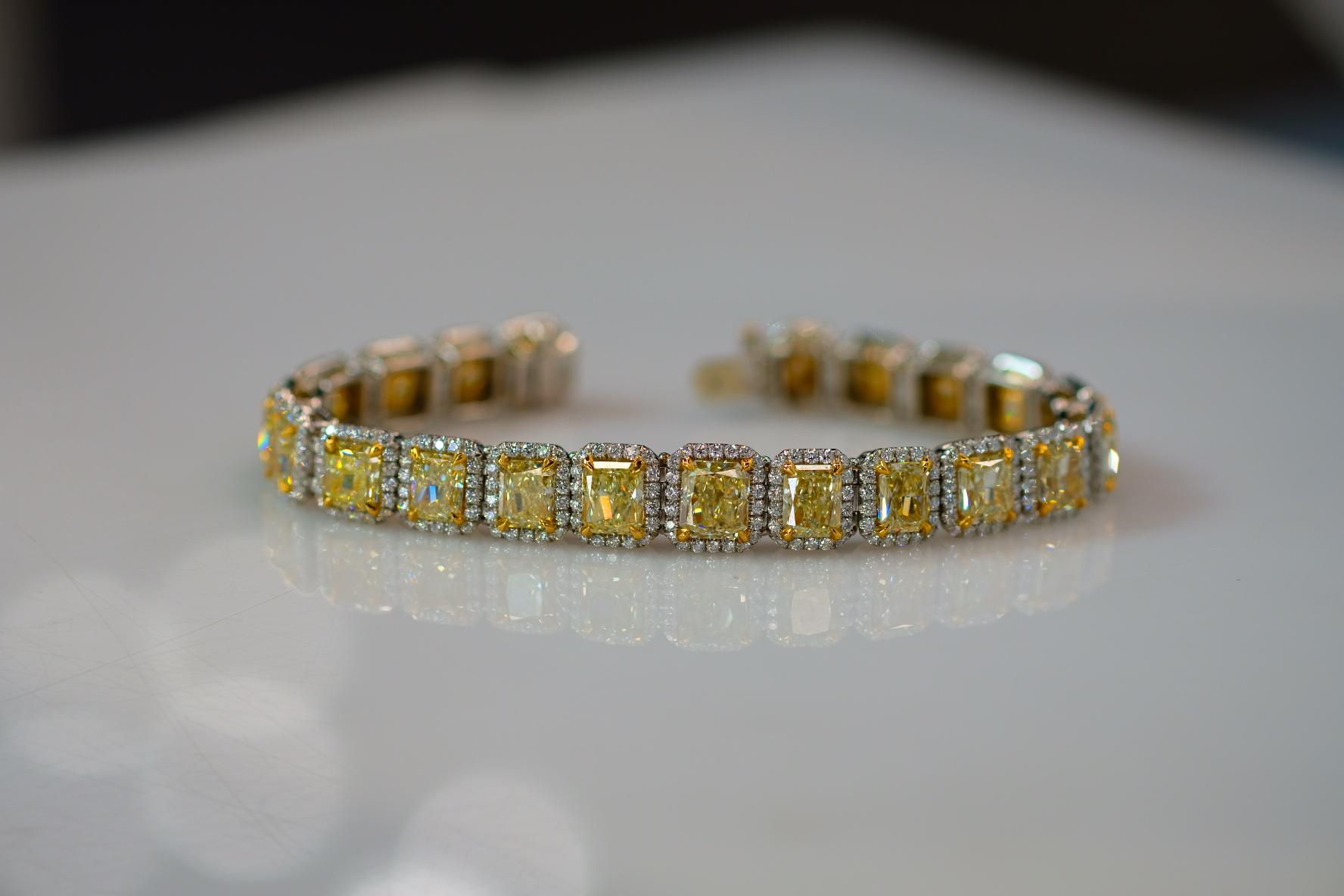 Sensational radiant cut diamond bracelet in 18K yellow gold and platinum mounted with 21 radiant cut diamonds. This handmade diamond bracelet is mounted with brilliant light fancy yellow XYZ colors GIA certified radiant cut diamonds. Each diamond is