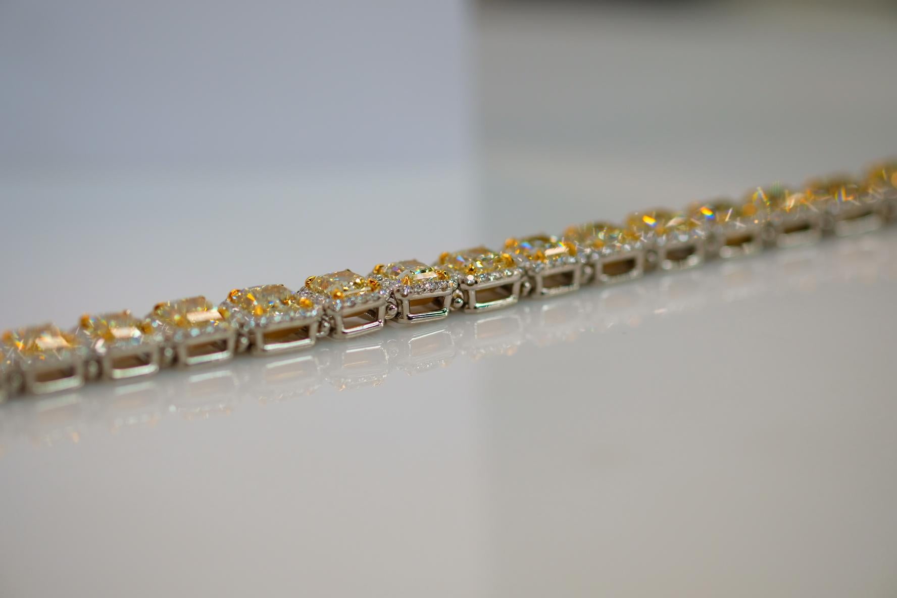 Handmade Radiant Cut Halo Set Light Natural Yellow Diamond Tennis Bracelet In New Condition In New York, NY