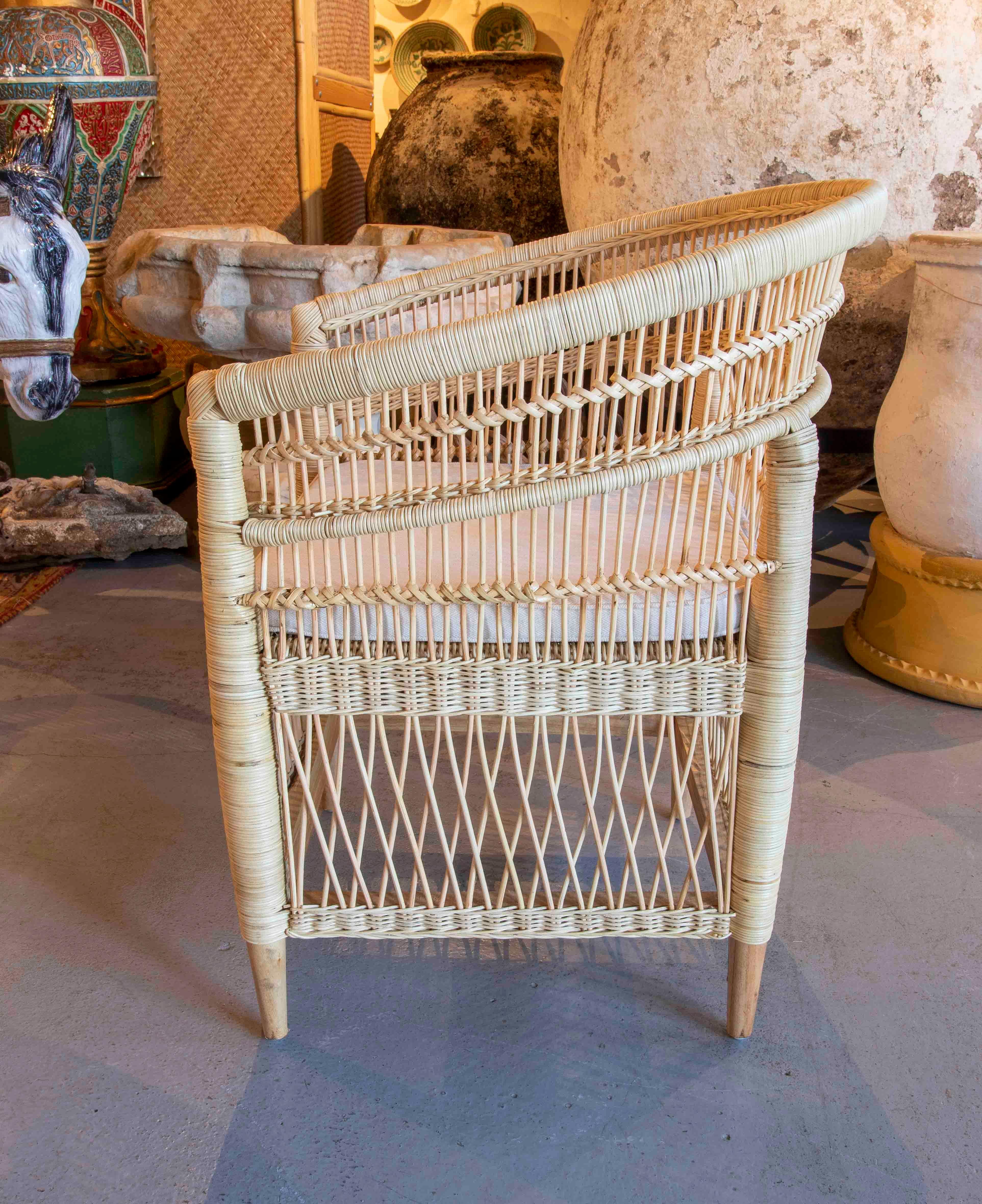 Contemporary Handmade Rattan Armchair with Wooden Legs For Sale