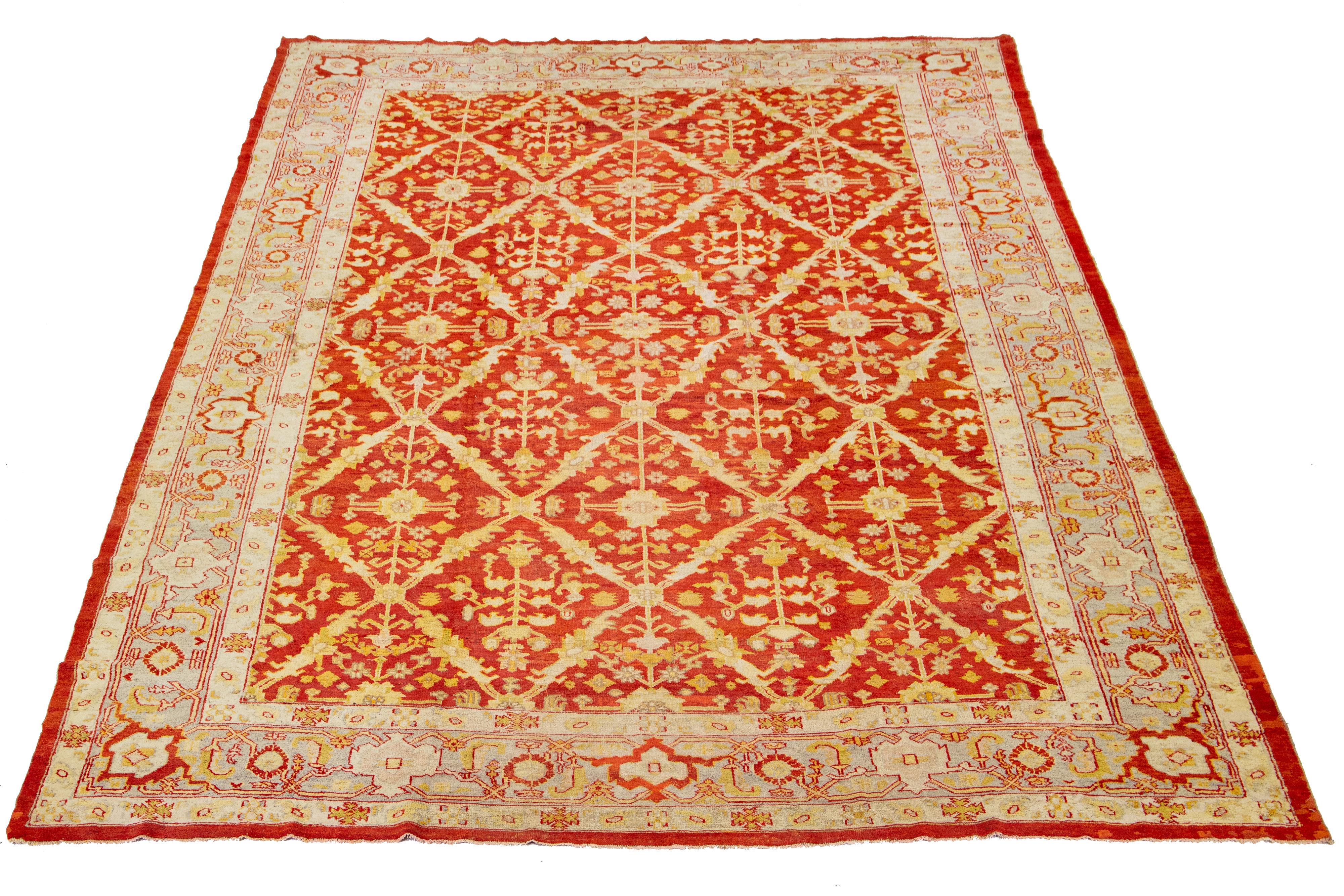 This antique Turkish wool rug is exceptional with its charming red base color and meticulous hand-knotted craftsmanship. It showcases stunning yellow-gold, beige, and gray accents, displaying a captivating floral pattern.

This rug measures 12'3