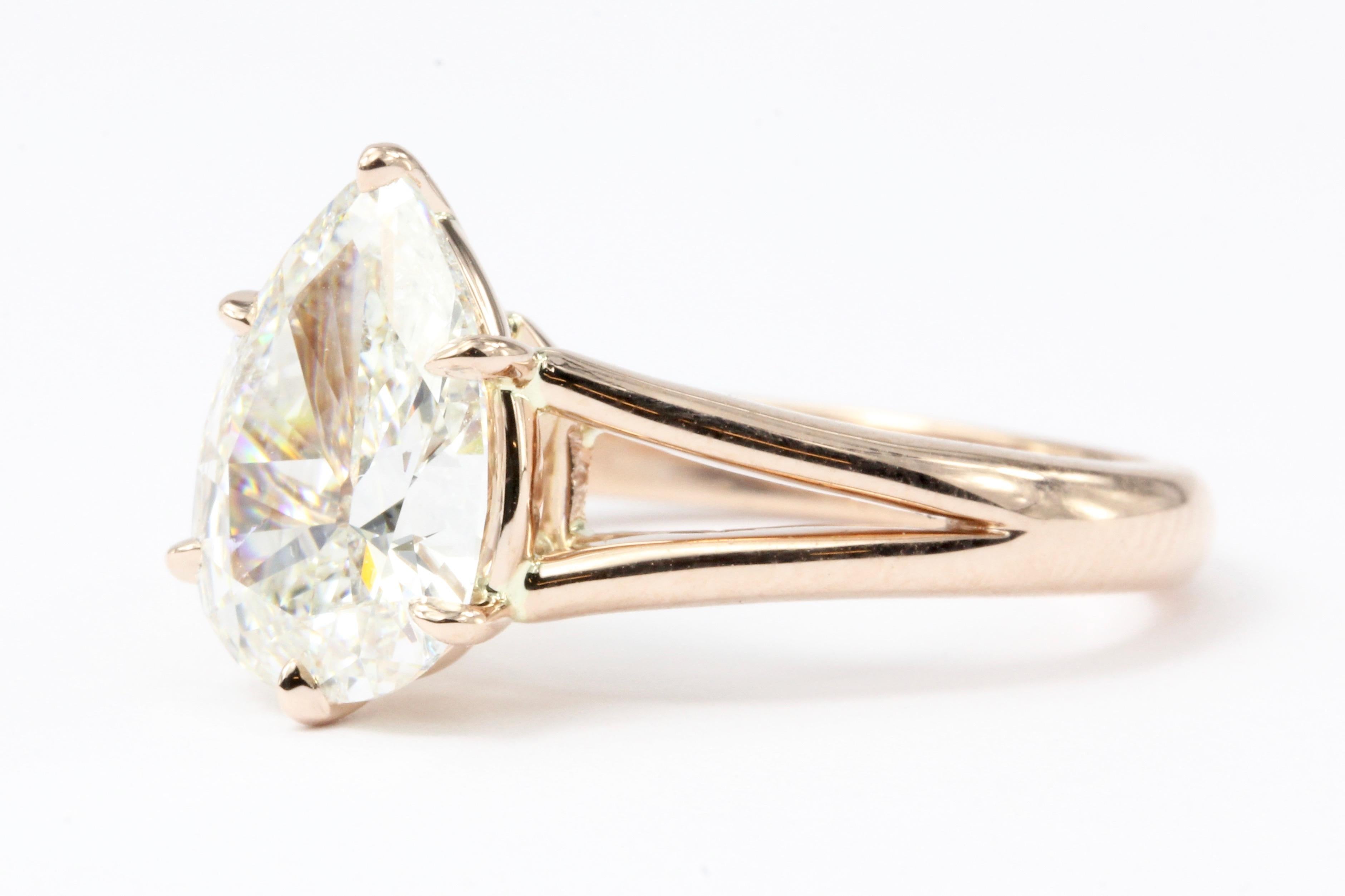 Era: Modern

Hallmarks: 14K

Composition: 14K Rose Gold

Primary Stone: Pear Shaped Diamond

Stone Carat: 2.36CT

Color / Clarity: H I1

Dimensions: 11.80 x 8.21 x 3.81mm

Shape: Pear

Ring Width: 12.8mm

Rise Above Finger: 6.65mm

Ring Size: