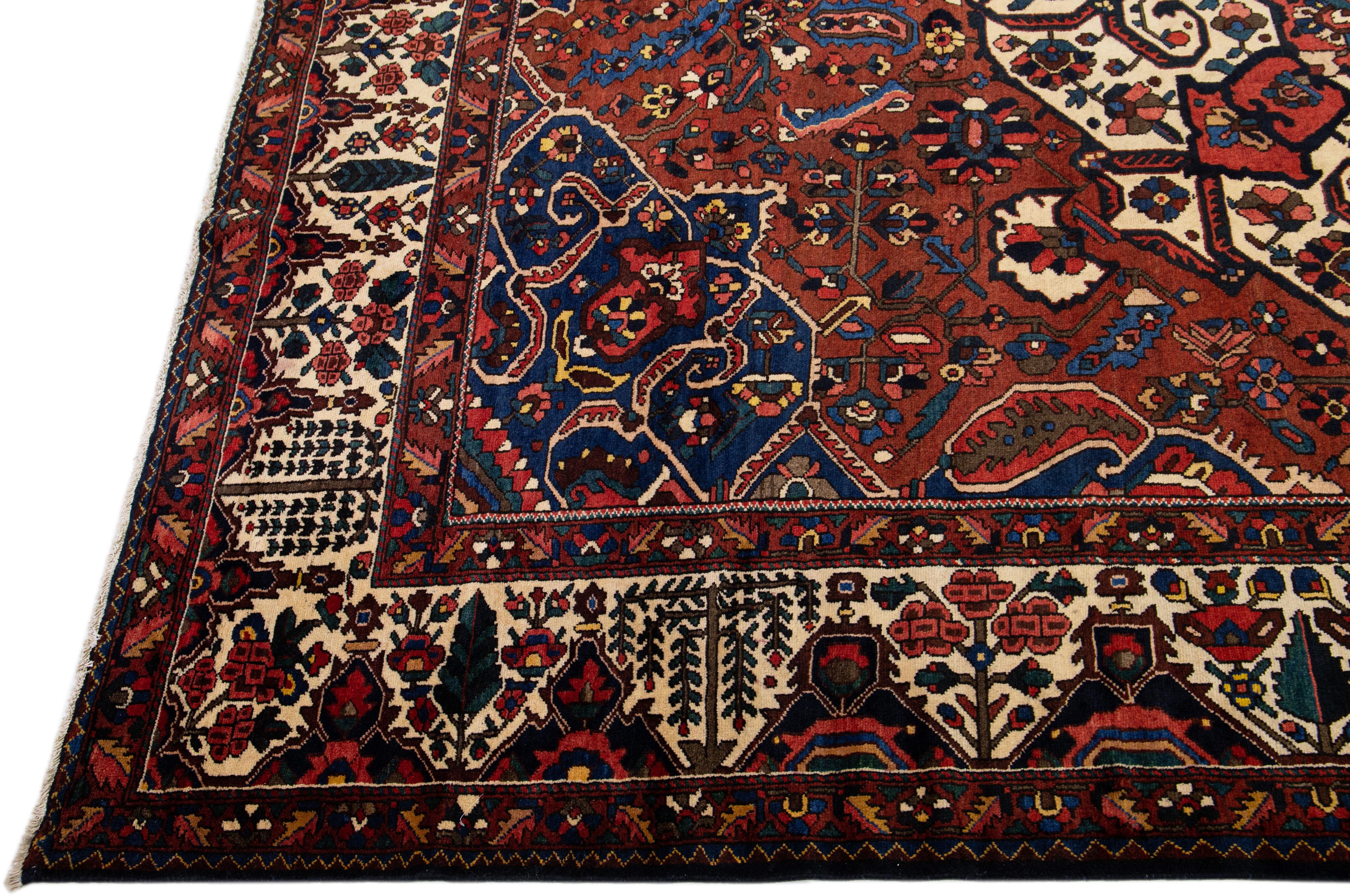 Islamic Handmade Rosette Antique Persian Bakhtiari Wool Rug With Red Color Field For Sale