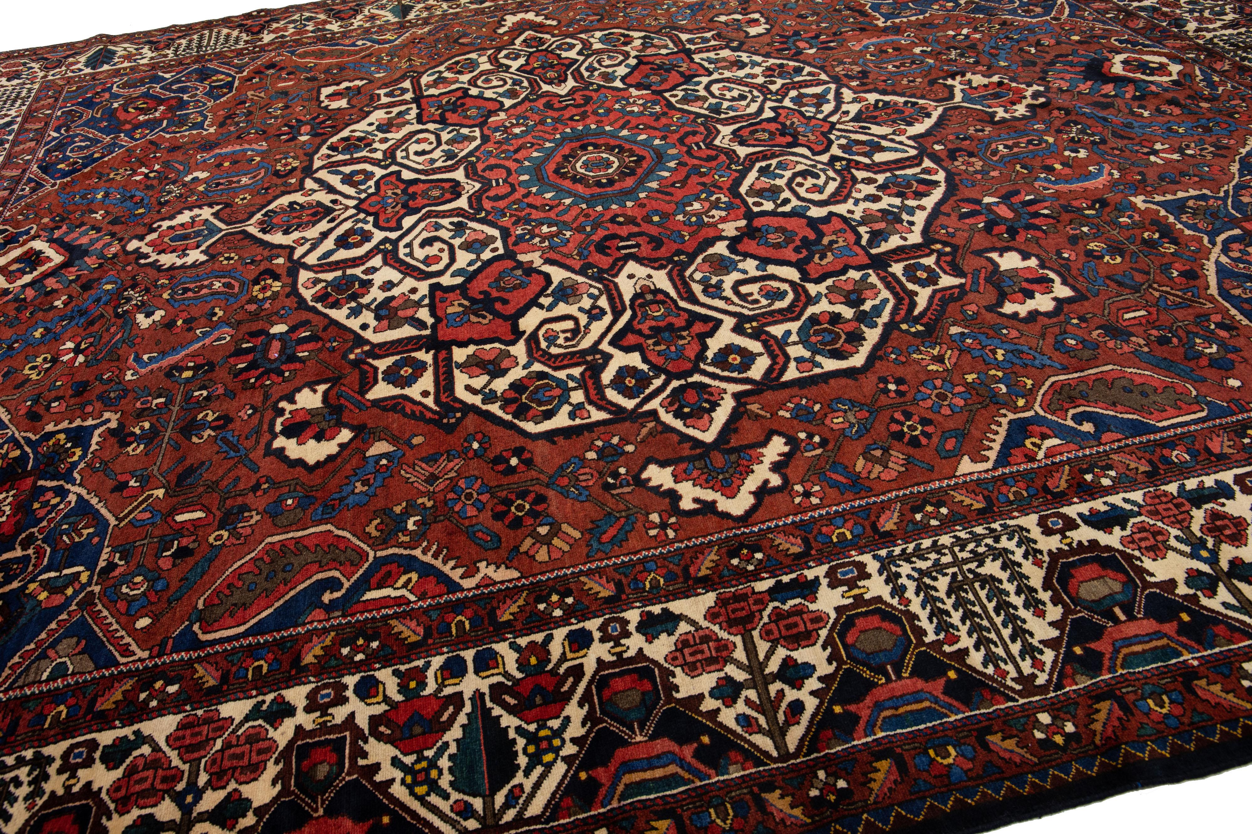 Hand-Knotted Handmade Rosette Antique Persian Bakhtiari Wool Rug With Red Color Field For Sale