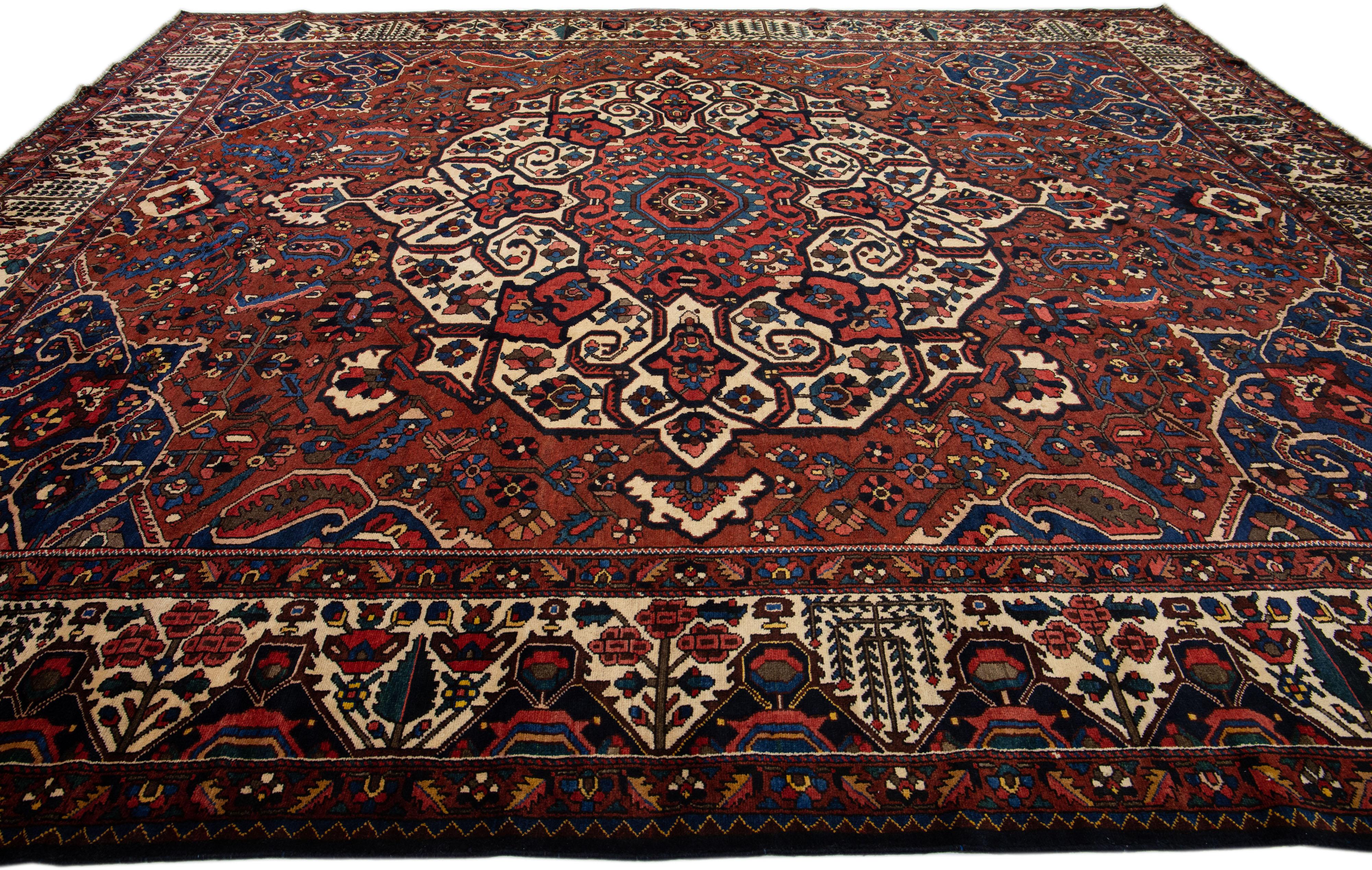 Handmade Rosette Antique Persian Bakhtiari Wool Rug With Red Color Field In Good Condition For Sale In Norwalk, CT