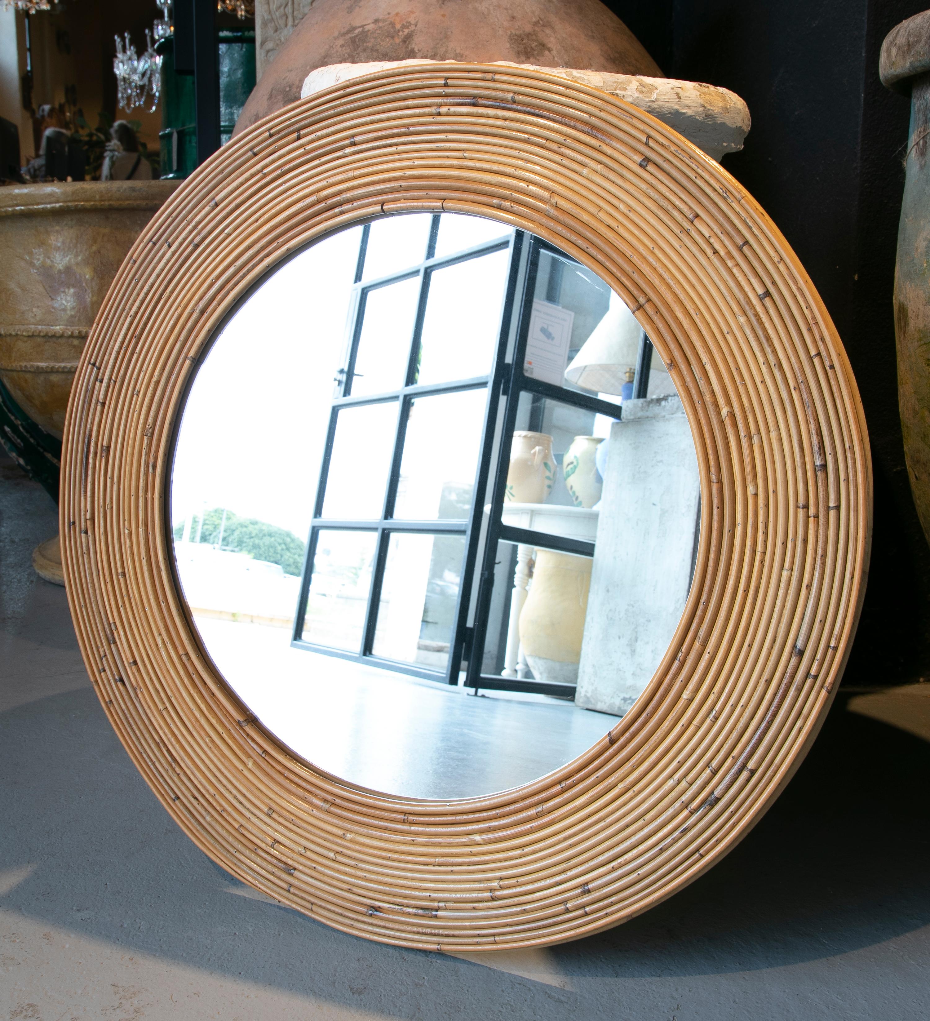 Handmade round bamboo mirror.
