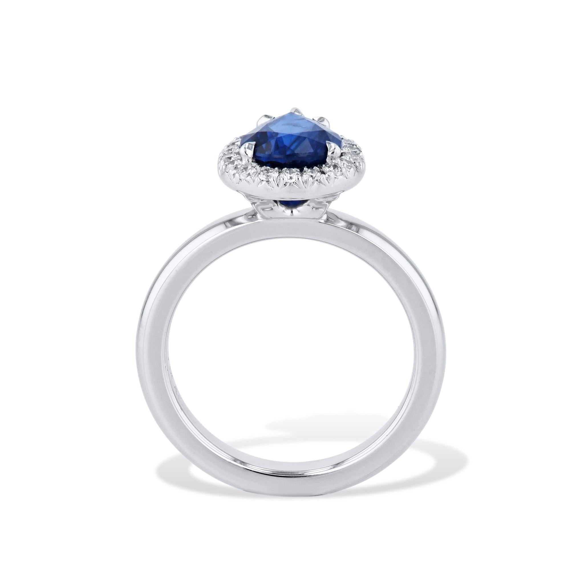 
This is a stunning royal blue pear shaped sapphire pave diamond platinum ring! 
The pear shape sapphire in the center is 1.89 carats. There are an additional 20 dazzling diamonds totaling 0.18 carats that are H in color and VS1 in clarity. 
This