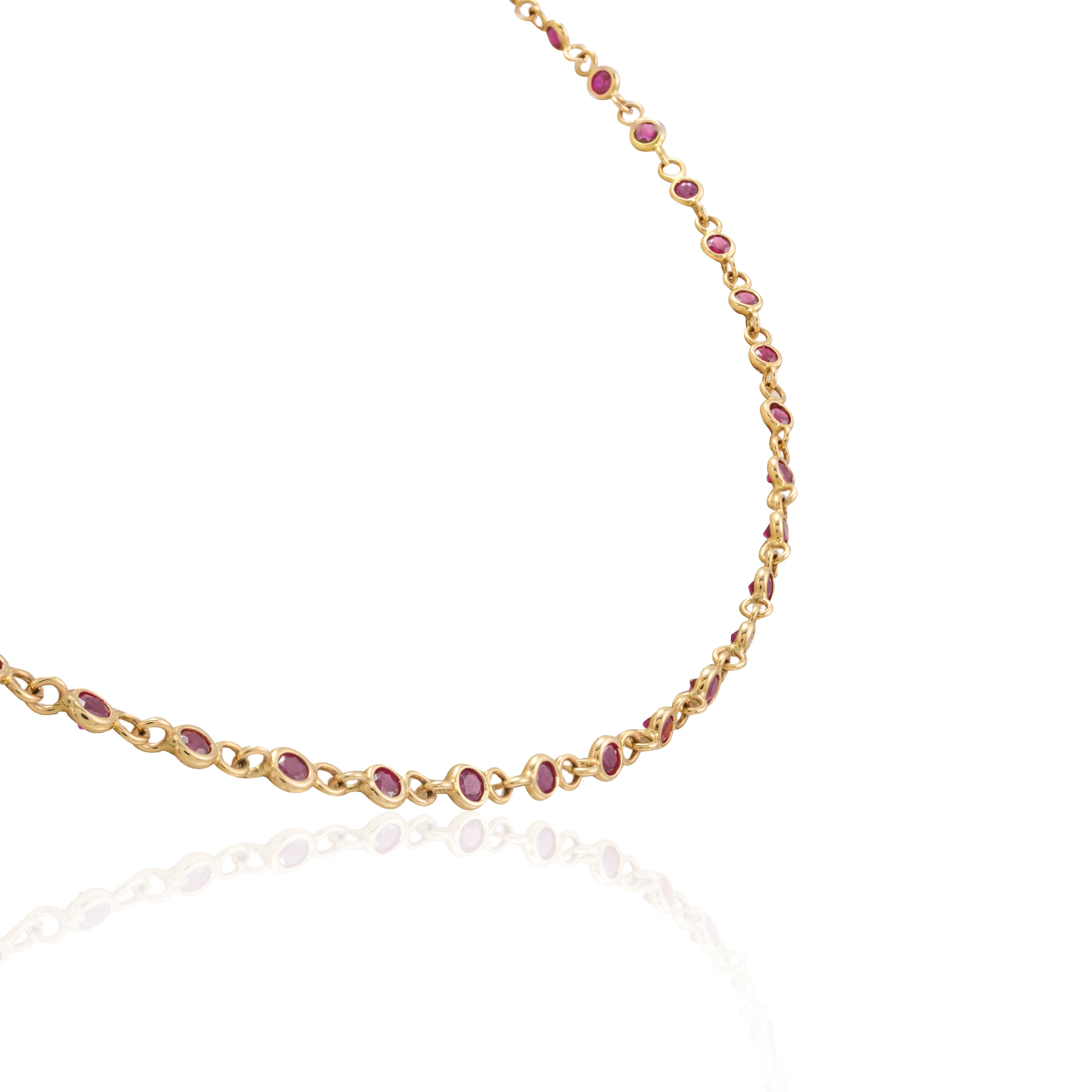 Handmade Ruby Station Chain Necklace in 14K Gold studded with round cut ruby studded all over the chain. This stunning piece of jewelry instantly elevates a casual look or dressy outfit. 
Ruby improves mental strength. 
Designed with a round cut